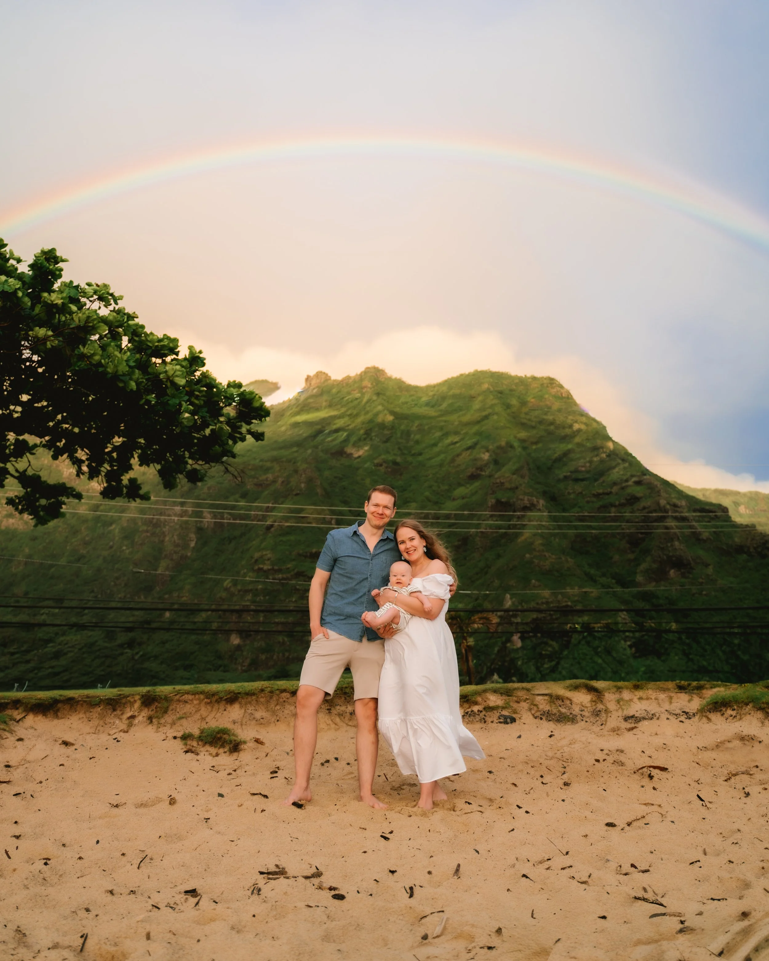 Sunrise newborn photography session at Kaaawa Beach on Oahu.