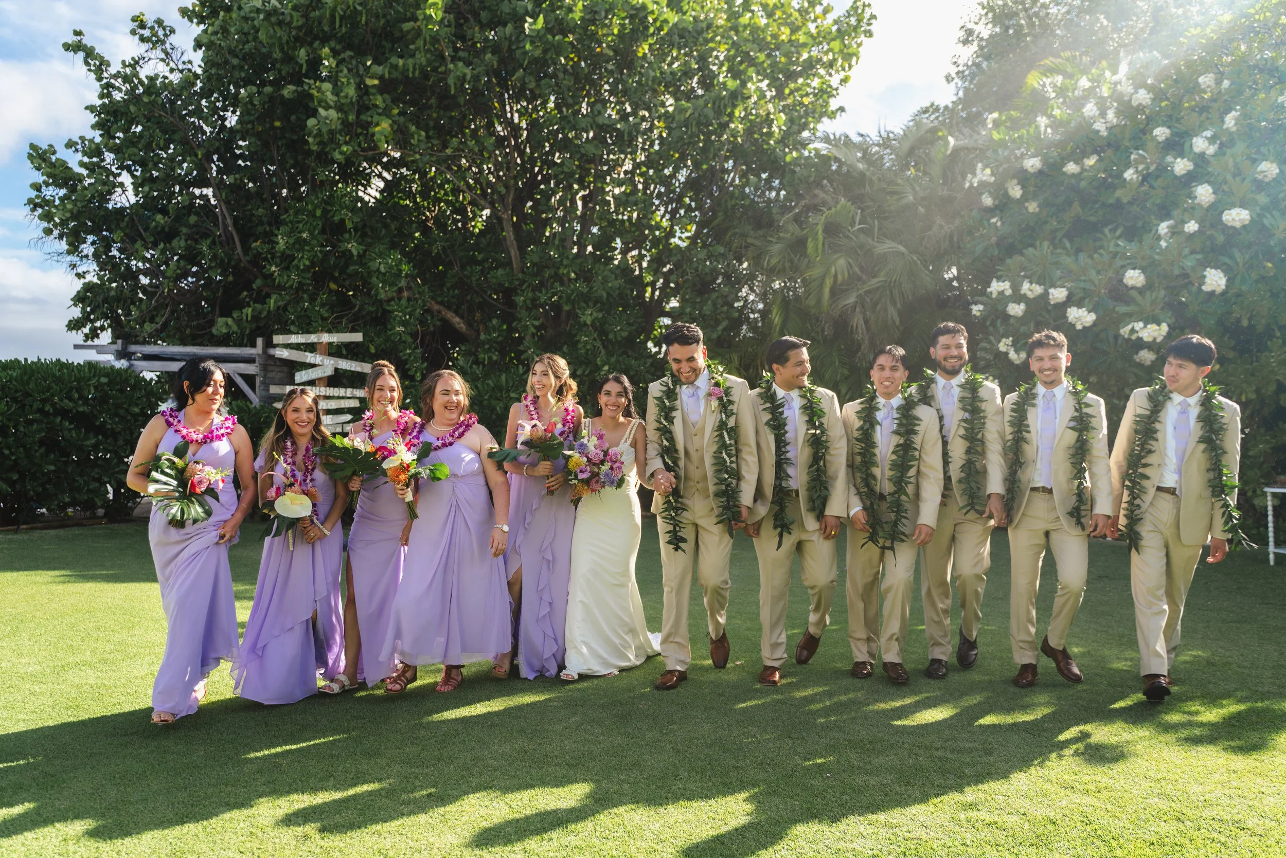 Bride groom and wedding party photographed together at Kaimea Estates in Hawaii