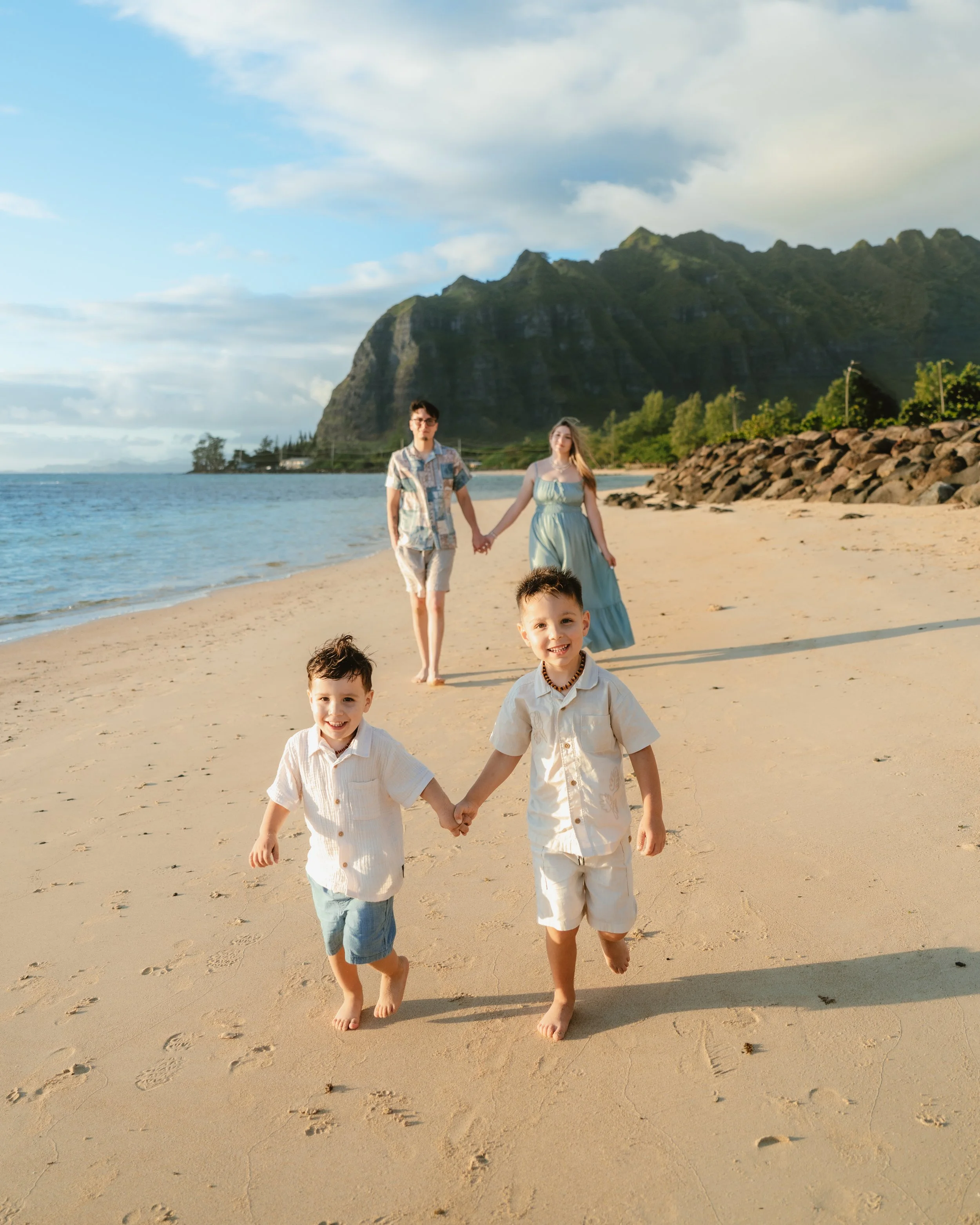 Candid running moments during a family photography session at kaaawa