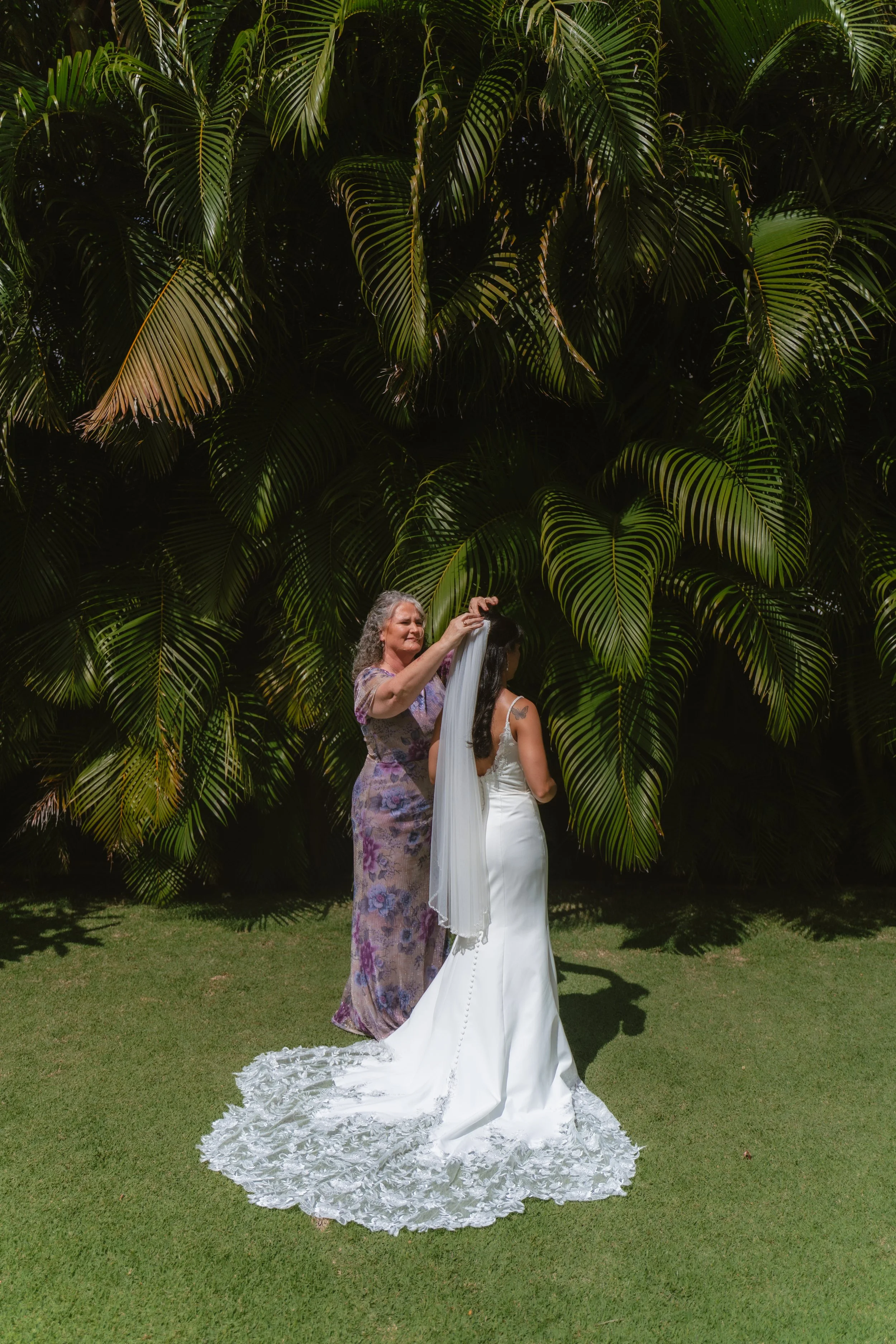 Bride sharing a special moment with her mother before her wedding at Kaimea Estates on Oahu