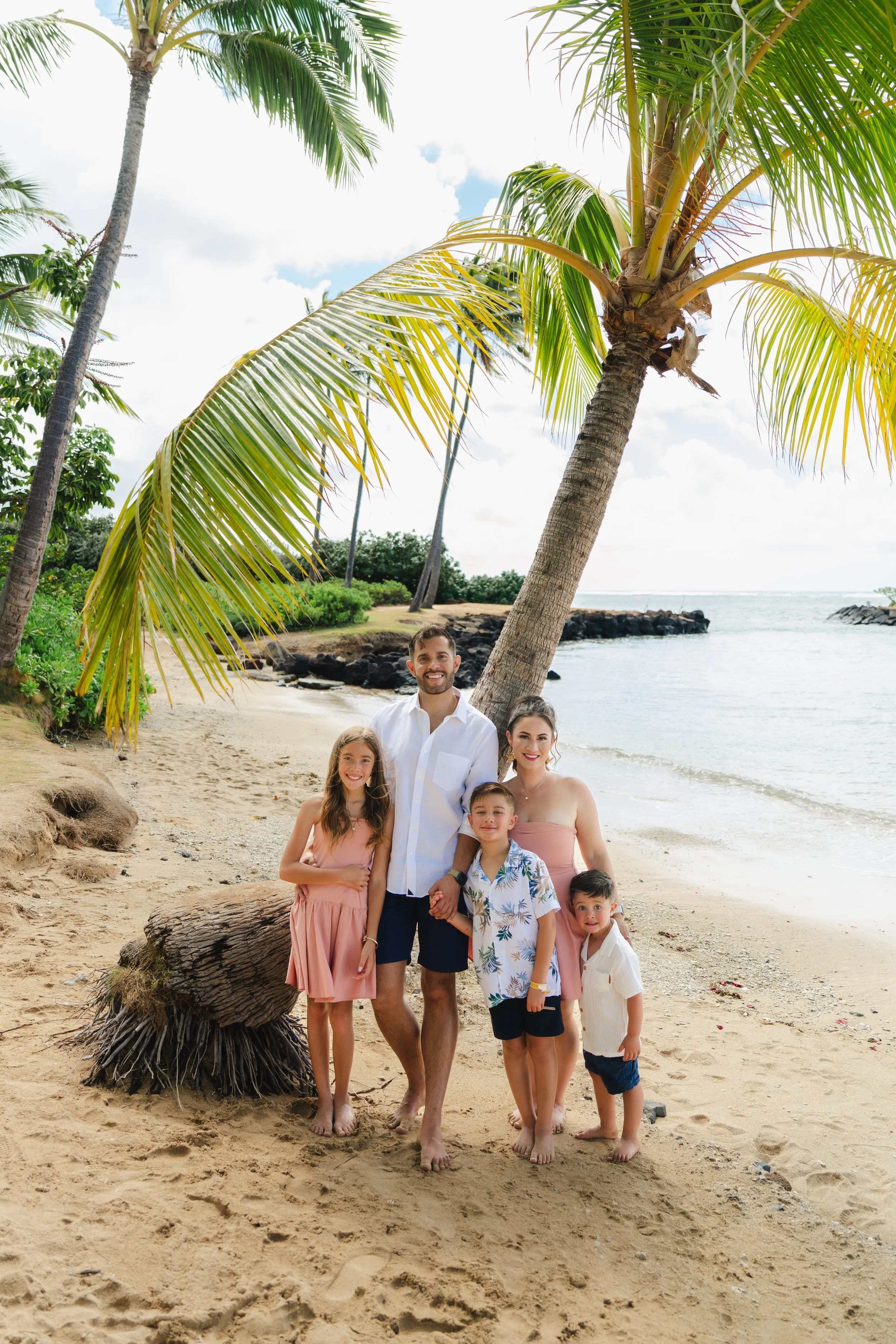 Natural family vacation photos during golden hour at Kahala Beach in Honolulu