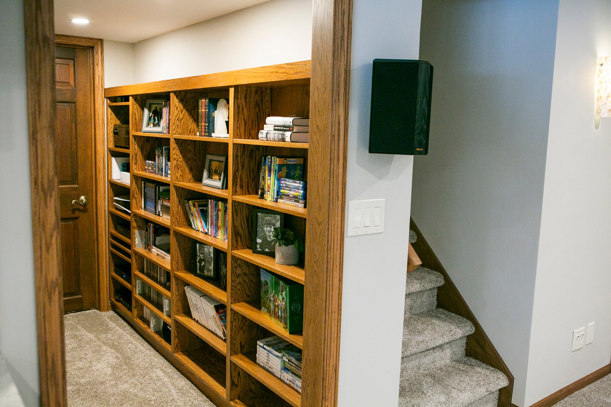  Basement hallway with built-in bookshelves. 
