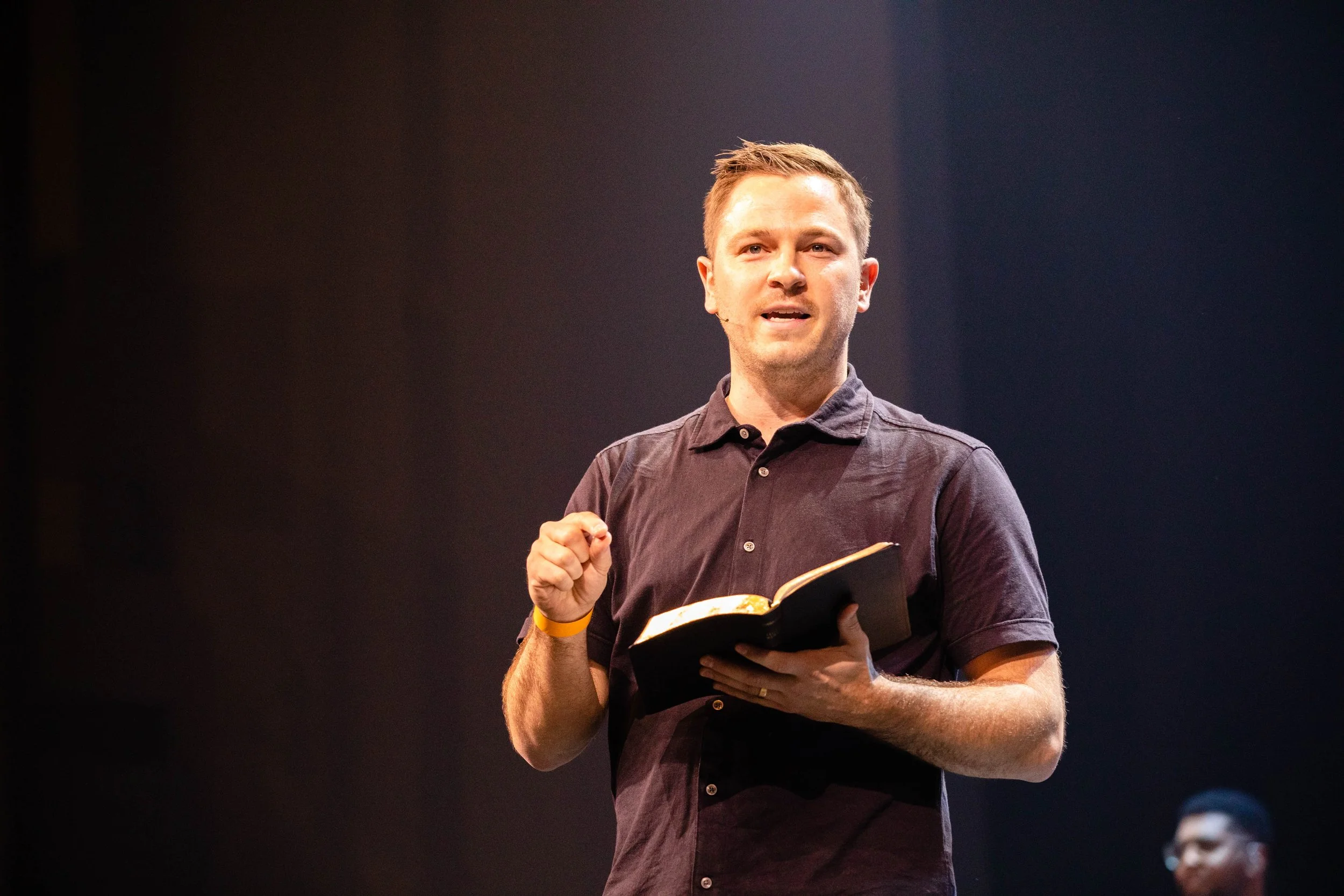 A man teaching from the Bible and encouraging others to grow up in their faith through wise and sound teaching.
