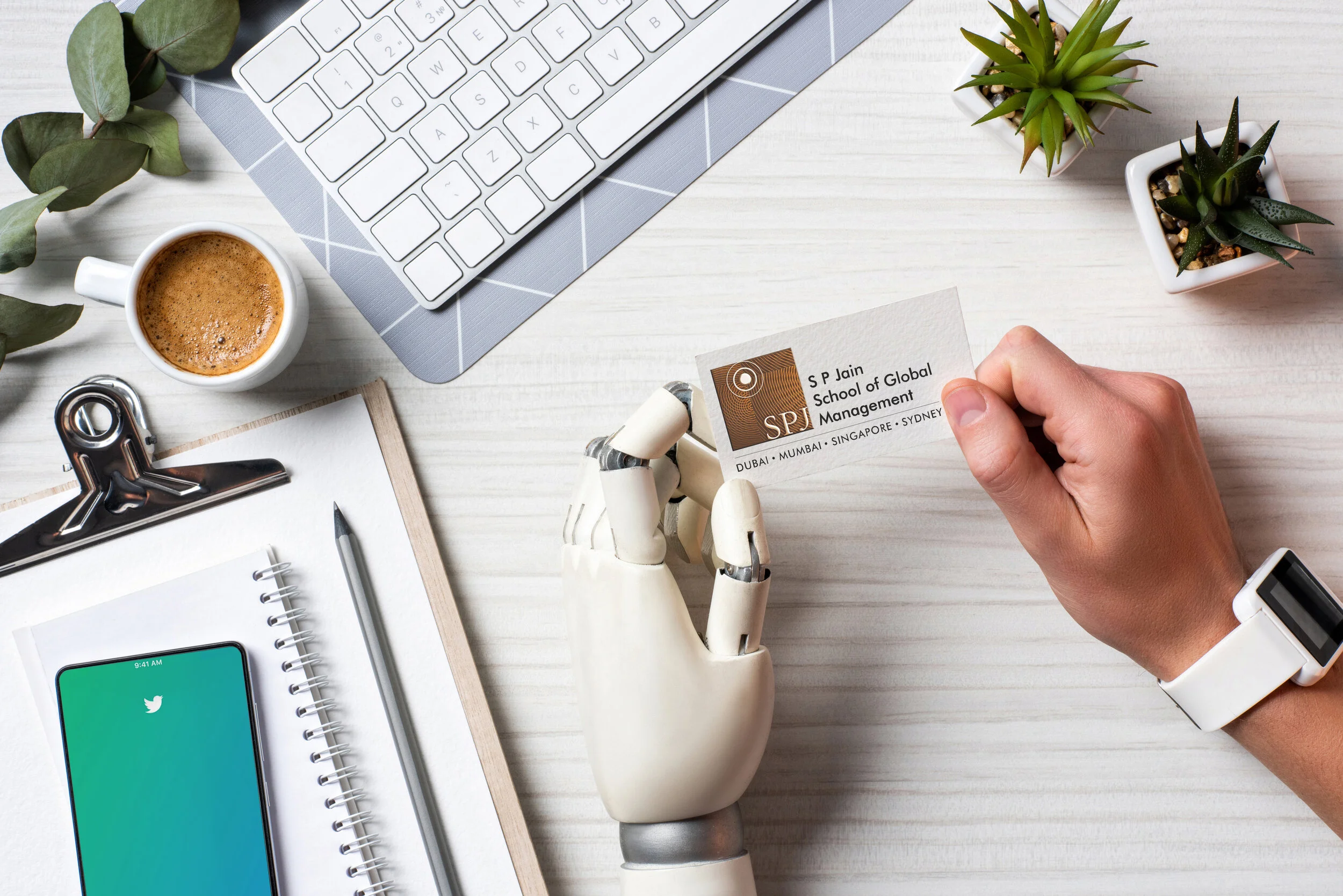 robot & human hands holding spjain business card.jpg