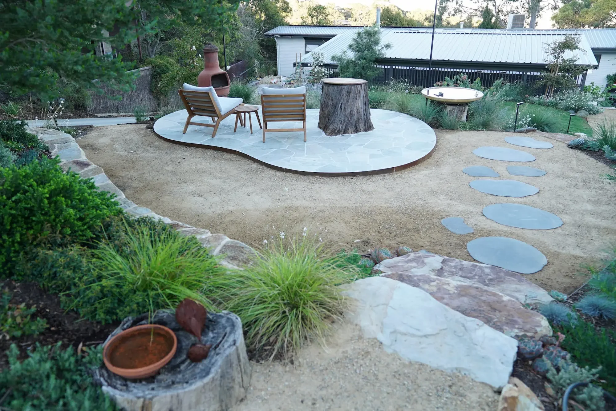 desert-flower-landscaping-scenic-court-belair-seating-area.webp