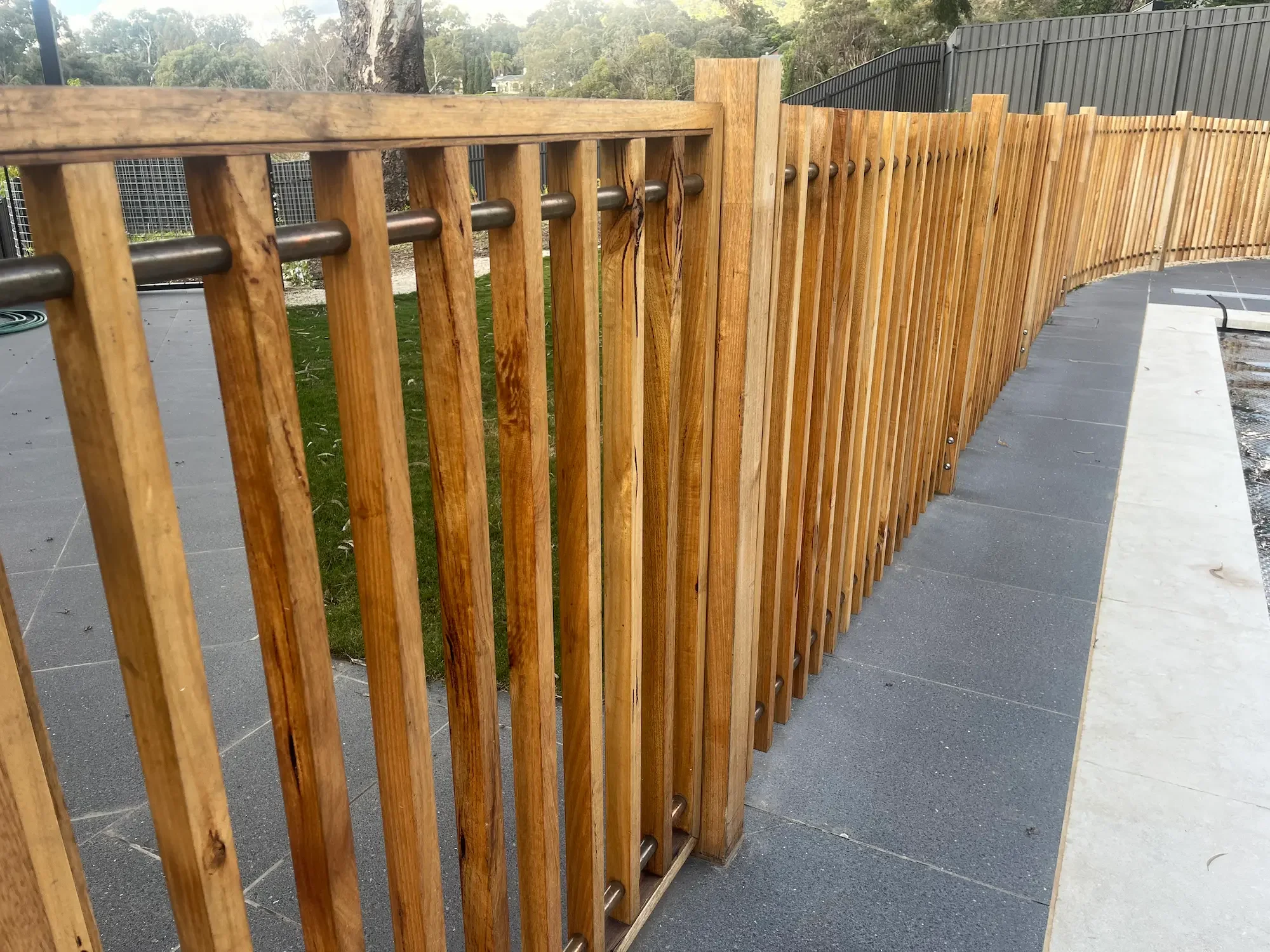 modern timber and copper fence surrounding a pool in Mitcham, Adelaide