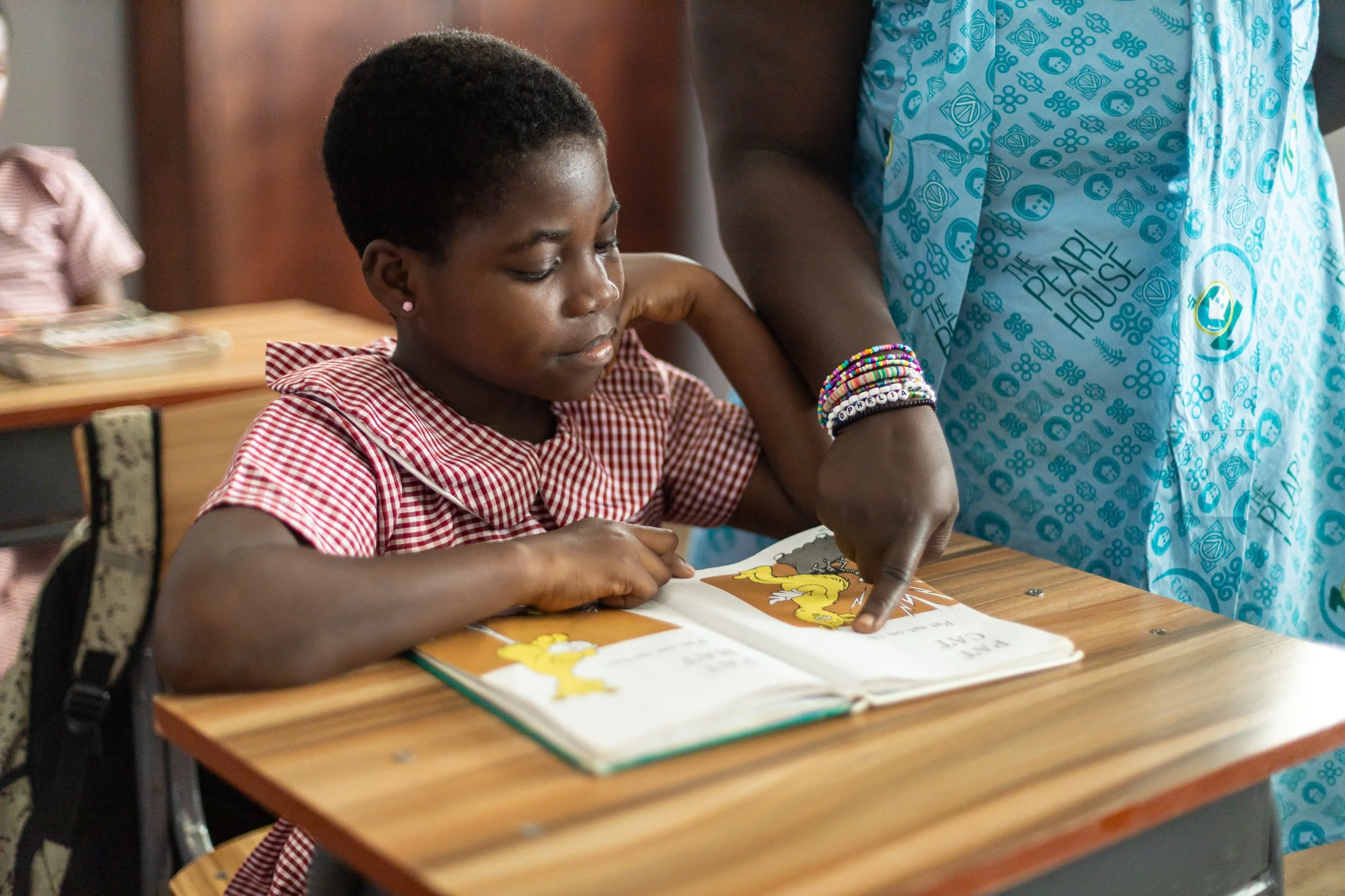 Young women receiving educational support at the Pearl House Haven