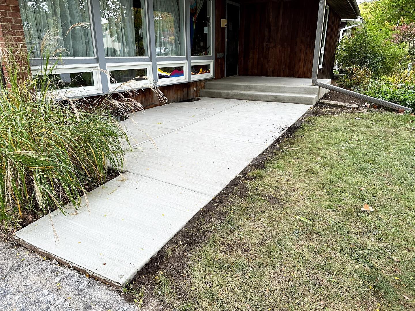 New concrete stoop and sitting pad.