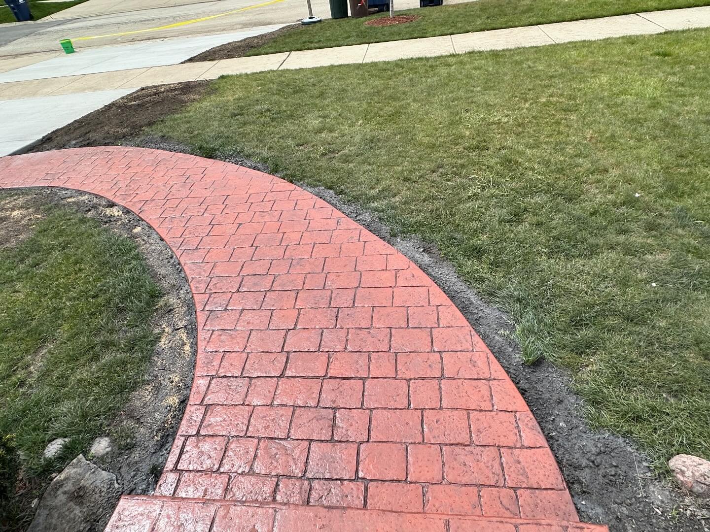 New stamped walkway. Pattern: Stamped cobblestone 
Primary Color: Hampshire Red
Grout lines/secondary color: Storm Gray