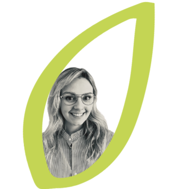 Chloe. A woman with glasses and wavy hair smiling, framed within a green leaf-shaped outline.