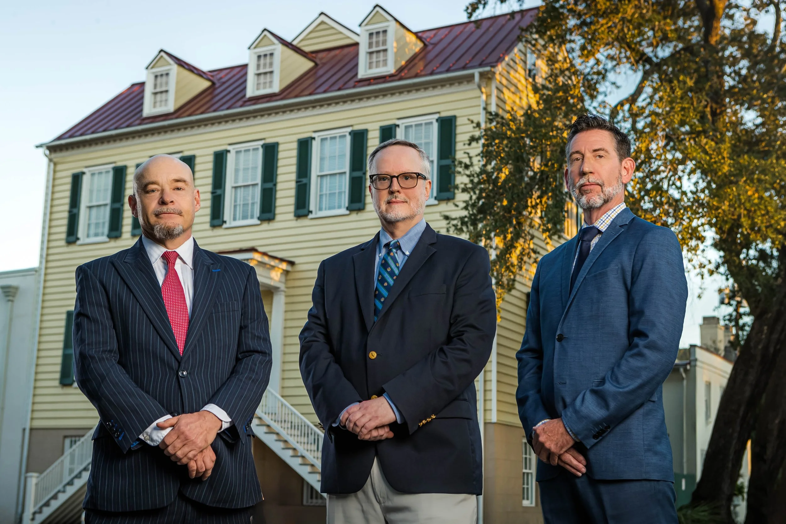 Partners of Thomerson Jones & Edwards P.C. law firm standing outside the historic Berrien House in Savannah, Georgia at sunrise — professional brand photography