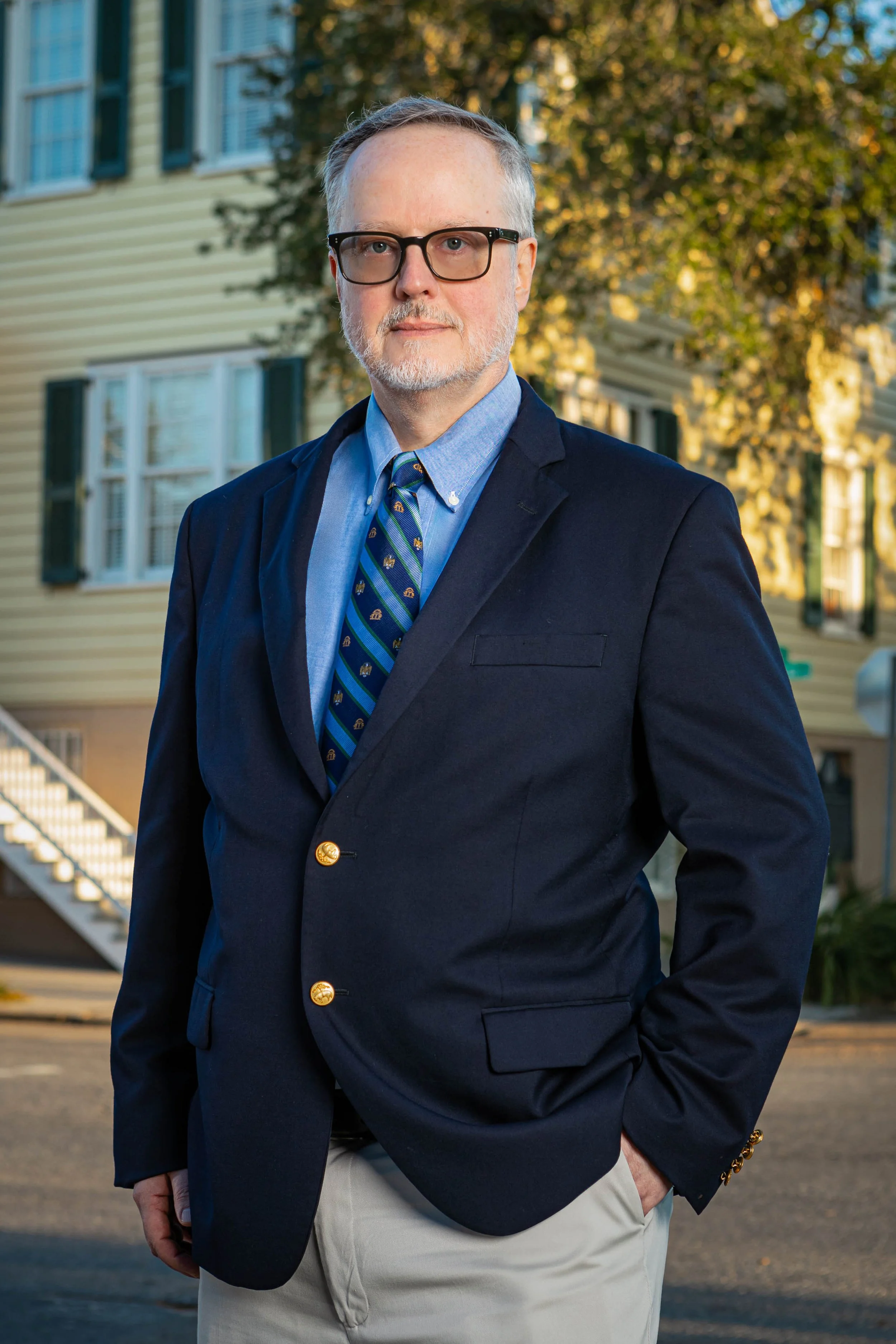 Portrait of partner Andrew Jones with Thomerson Jones & Edwards P.C. in front of the Barrien House with confident stance — professional law firm brand photography by Weaver Media