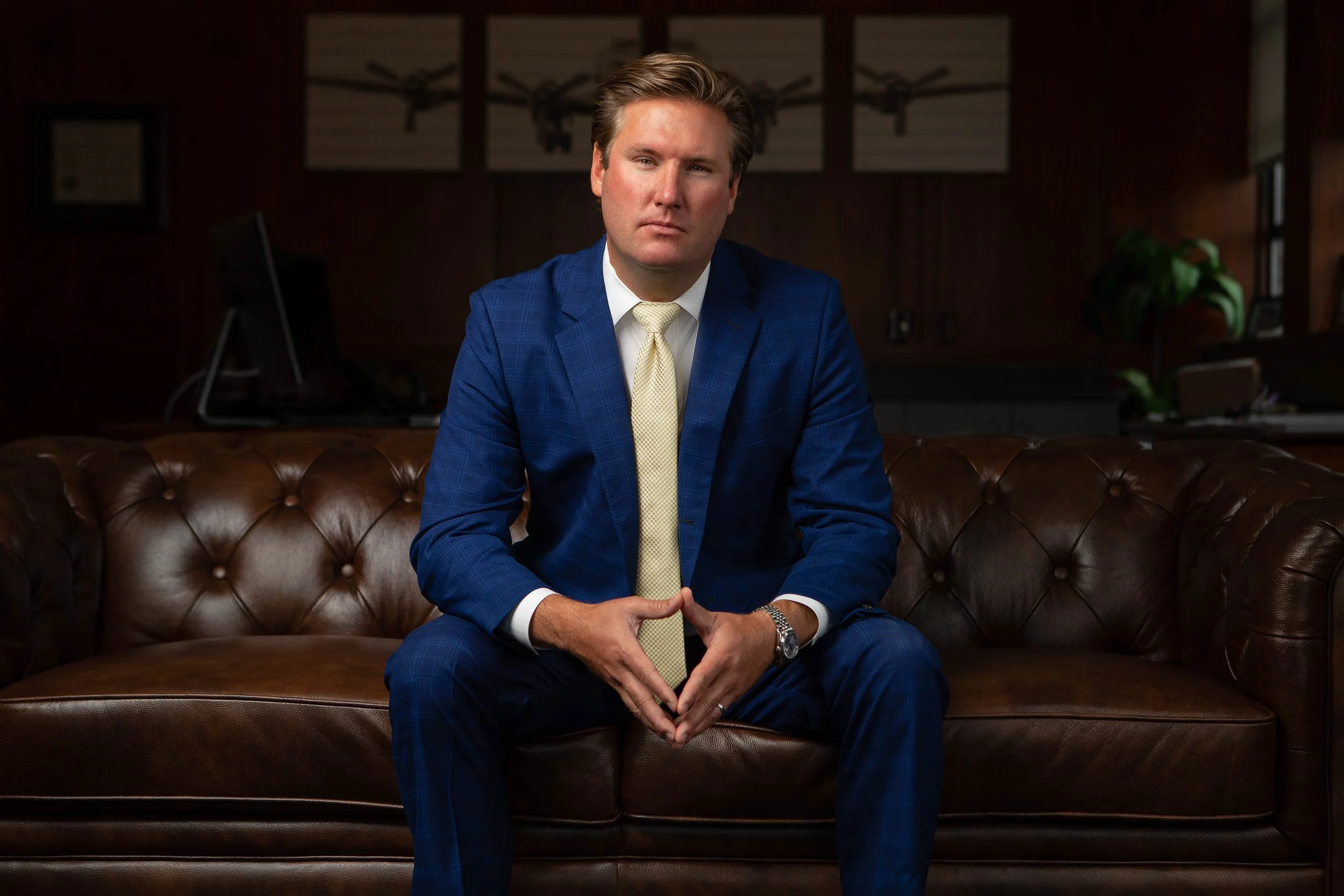 Professional portrait of business executive inside Greenville, South Carolina office — corporate photography and law firm brand photography