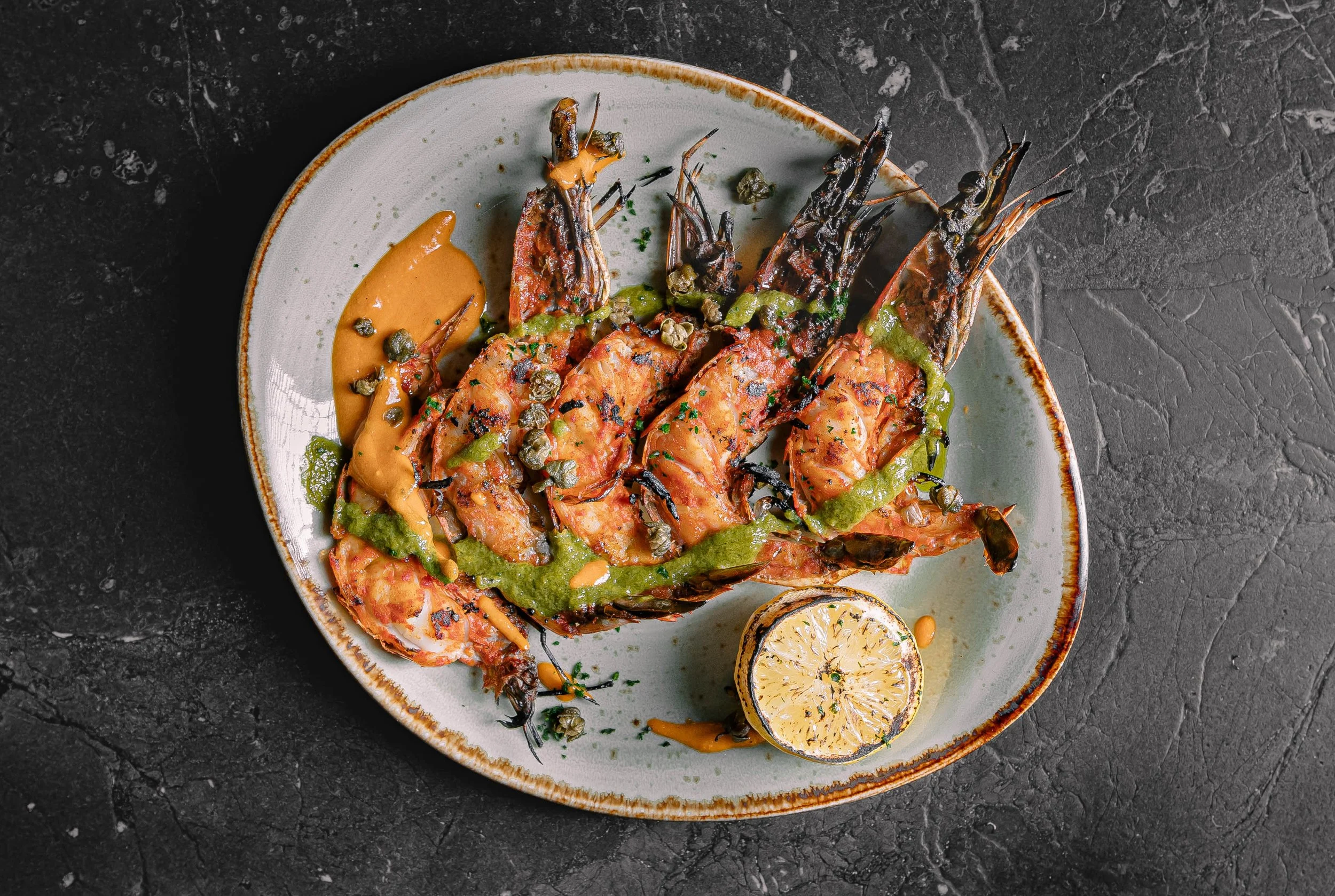 Grilled shrimp with herb sauce plated at Curean Mediterranean restaurant in Greenville, South Carolina — gourmet restaurant food photography by Weaver Media