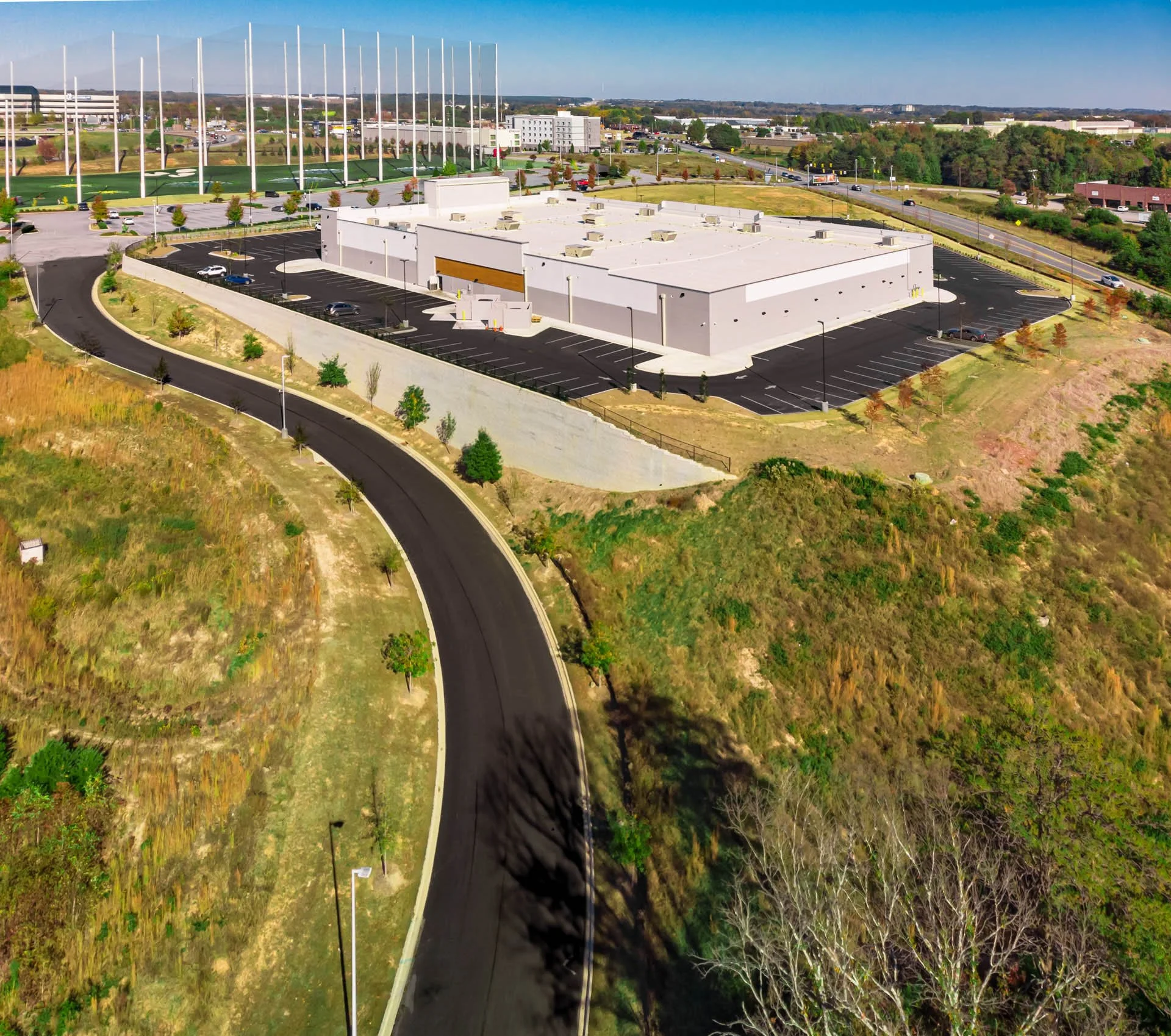 Commercial construction project near Topgolf Greenville, SC with road paving by Lassiter Taylor Construction — construction marketing photography