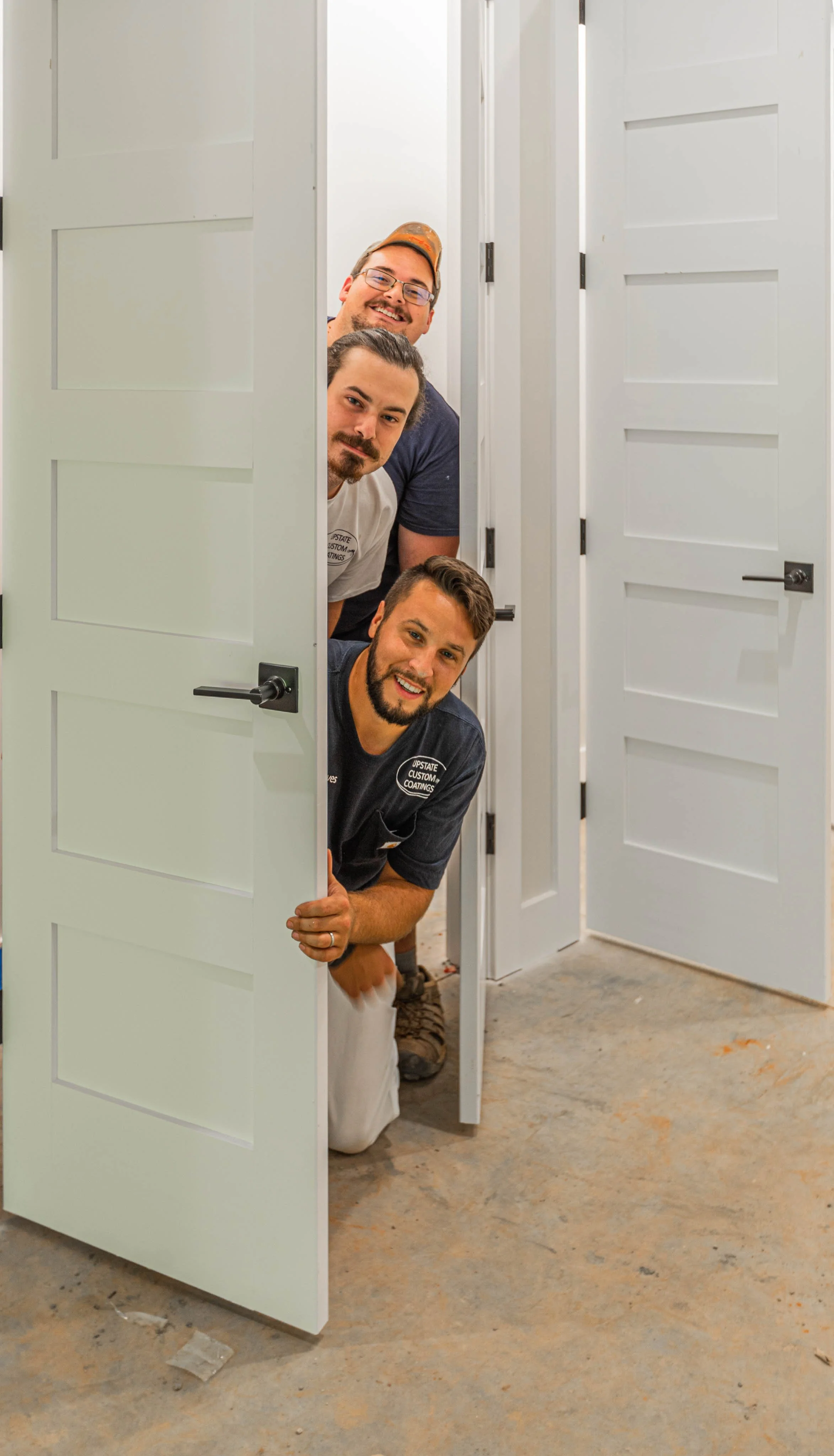Upstate Custom Coatings painting crew inside renovation project in Greenville, South Carolina — brand storytelling photography by Weaver Media