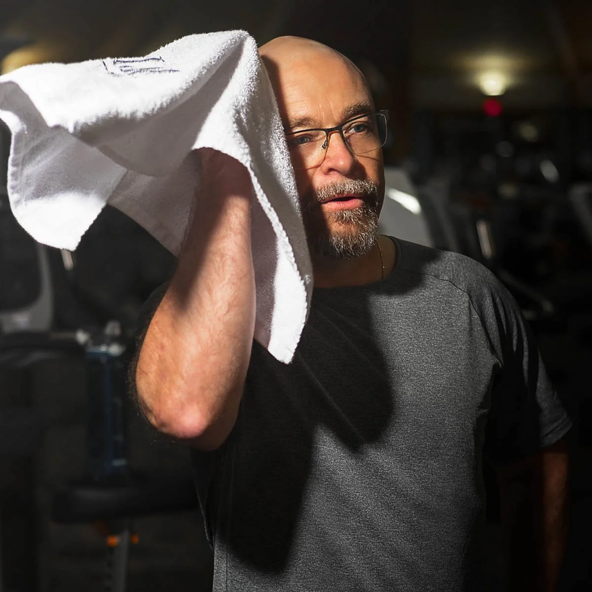 Michael Thomerson, managing attorney of Thomerson Jones & Edwards P.C. in the gym drying off after workout — lifestyle brand storytelling photography by Weaver Media