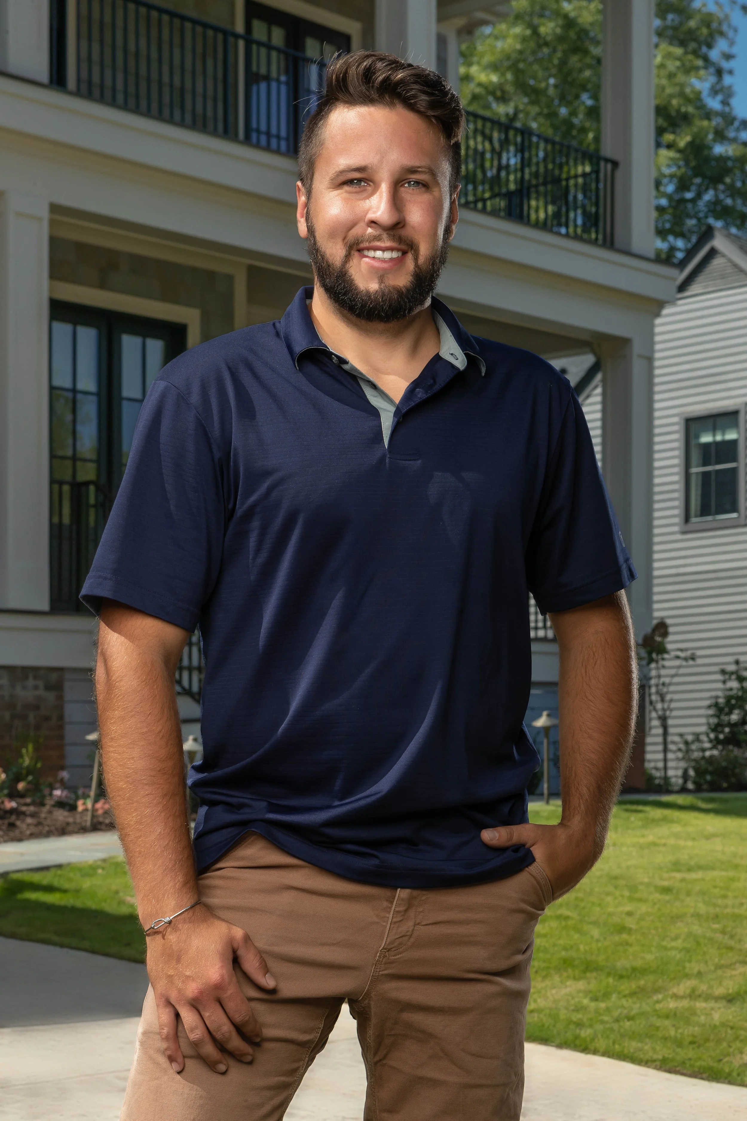 Owner of Upstate Custom Coatings standing outside residential project in Greenville, SC — professional brand photography by Weaver Media