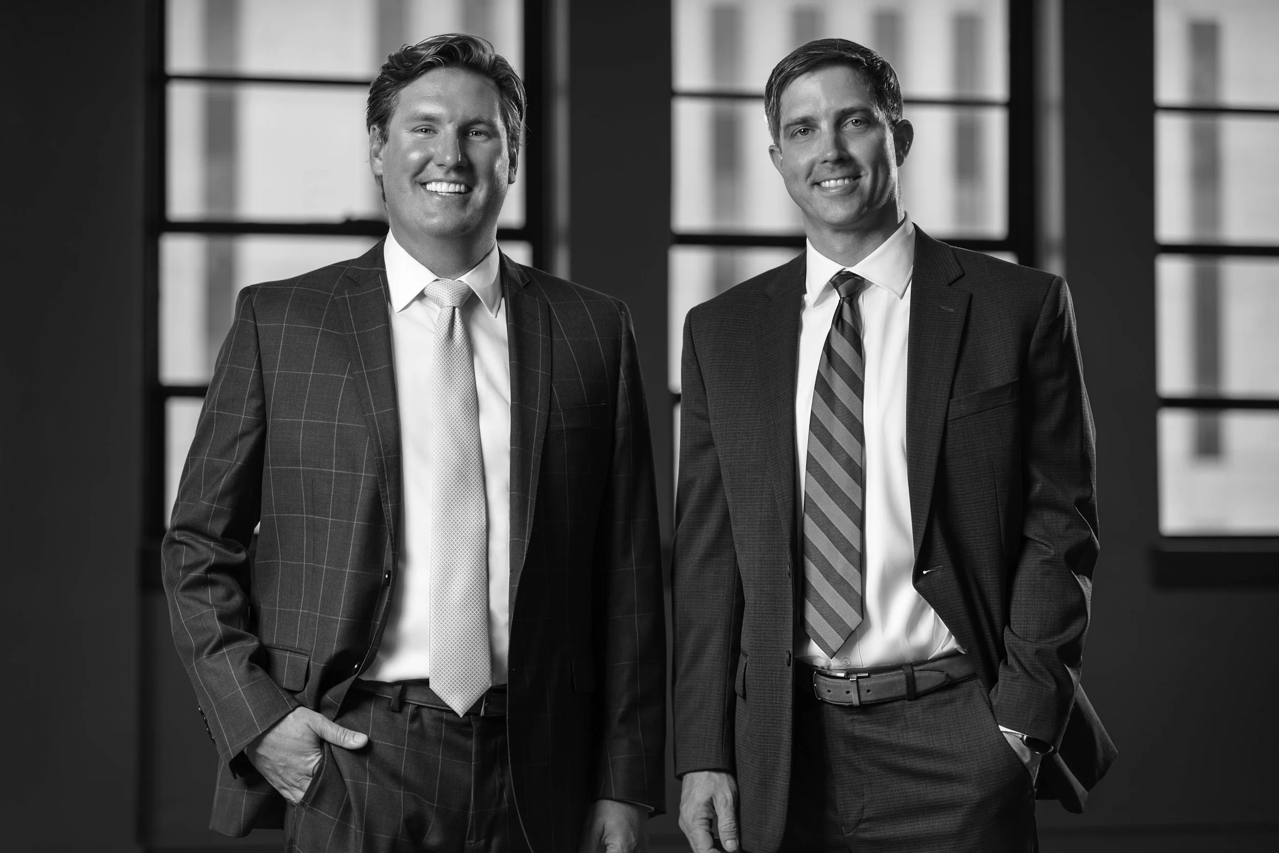 Managing attorneys of Angell Molony standing inside modern Greenville office — corporate photography and law firm brand photography by Weaver Media.
