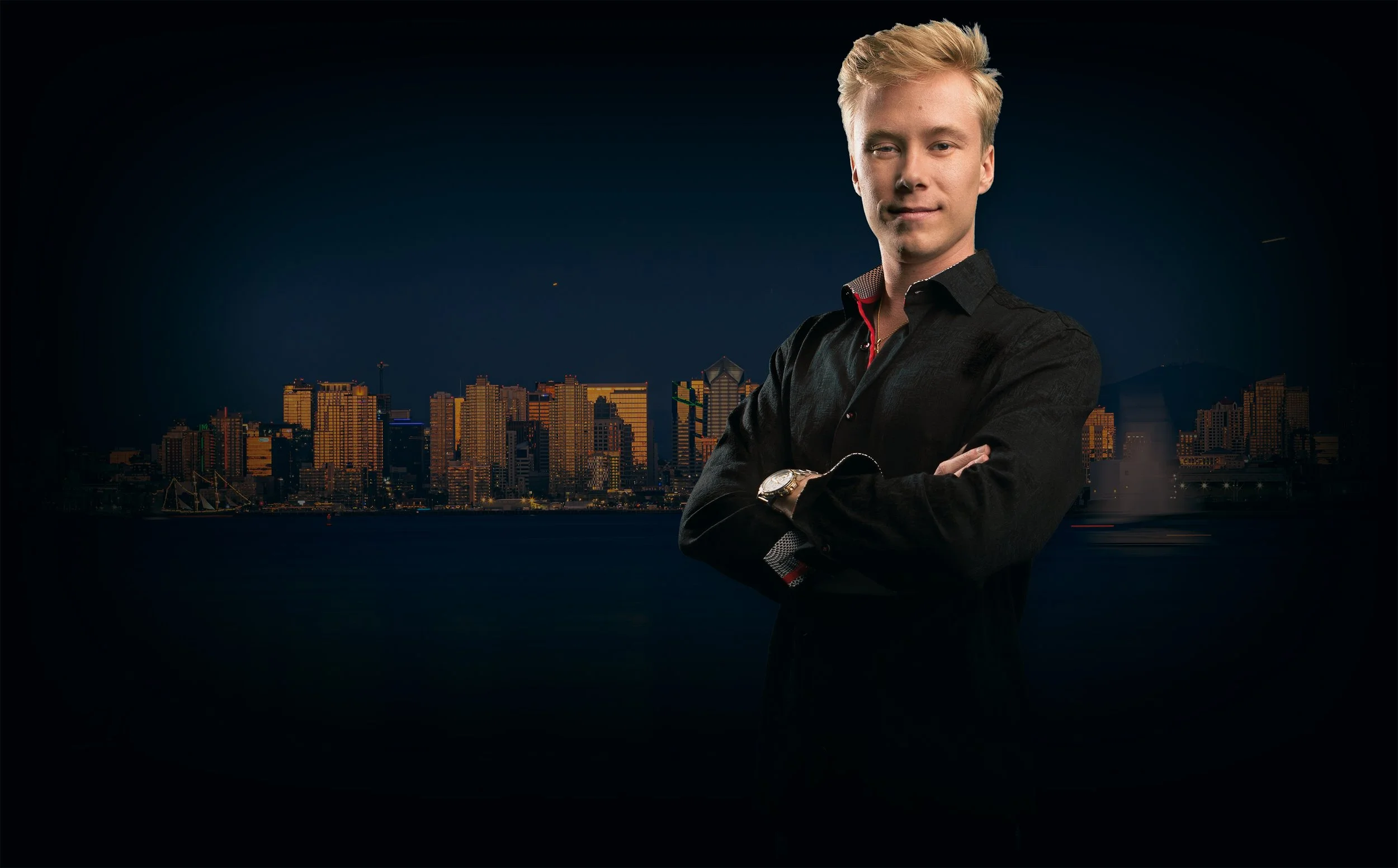 Nicholas Weaver poses for a portrait with the San Diego Skyline in the background