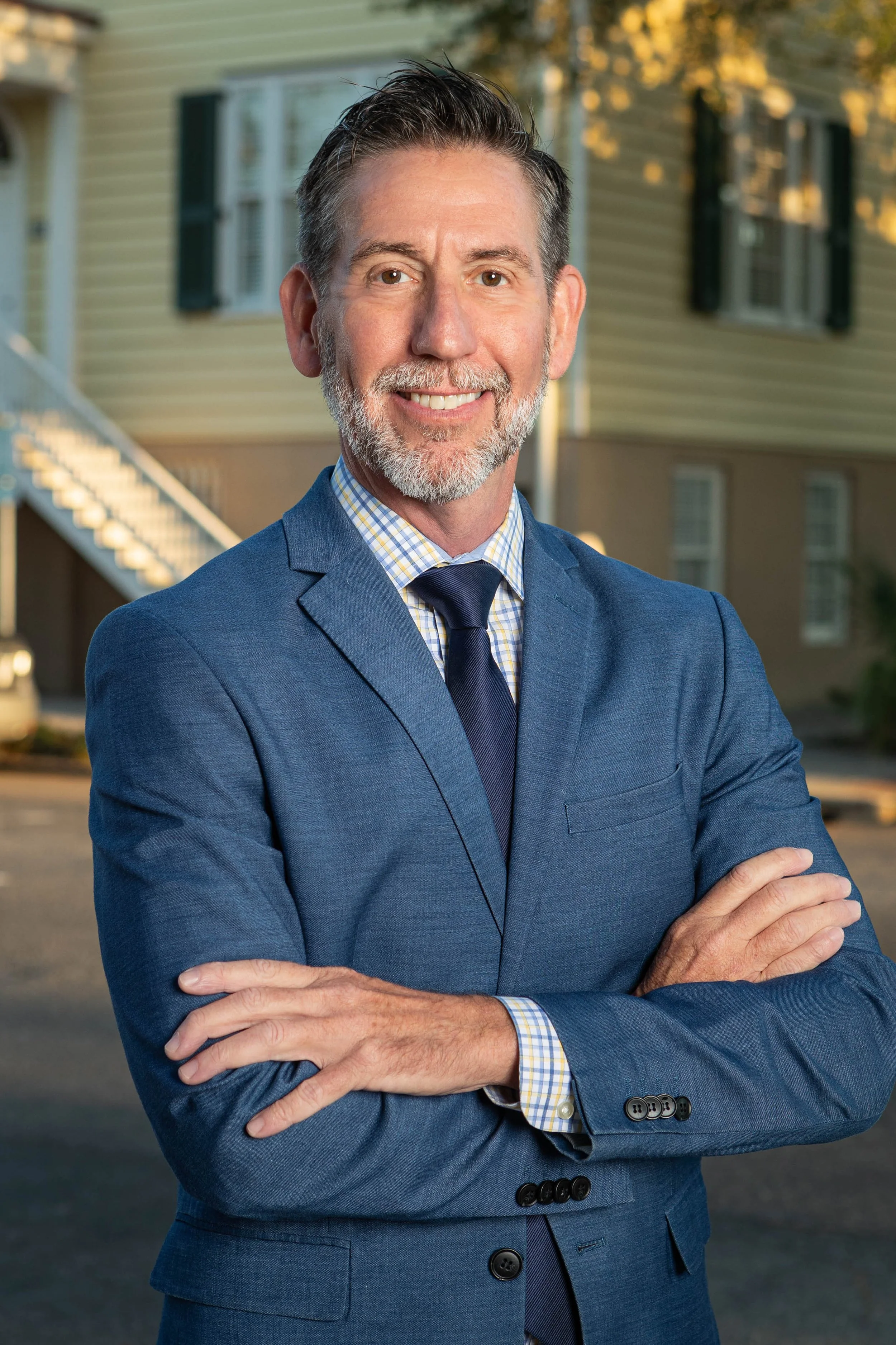 Portrait of partner Michael Edwards with Thomerson Jones & Edwards P.C. in front of the Barrien House with confident stance — professional law firm brand photography by Weaver Media