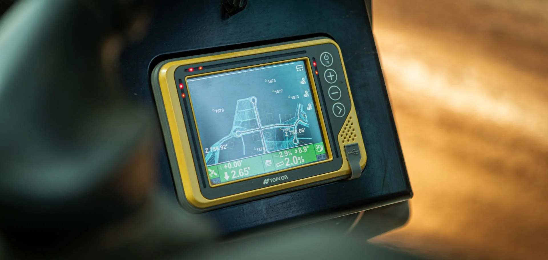 Topcon GPS surveying system used for land measurement on Lassiter Taylor Construction project in Greenville SC — industrial construction photography