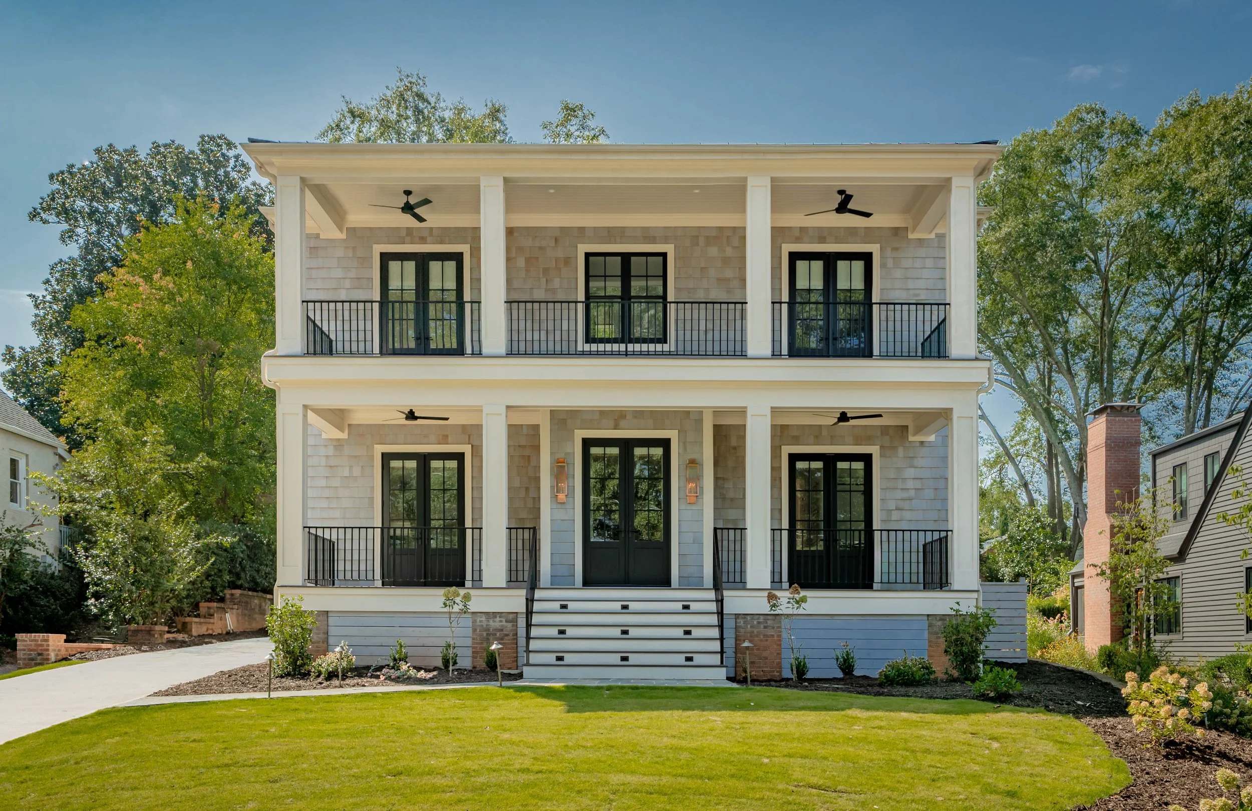 Luxury home exterior with porch and landscaped yard in Greenville, SC — residential architectural photography by Weaver Media