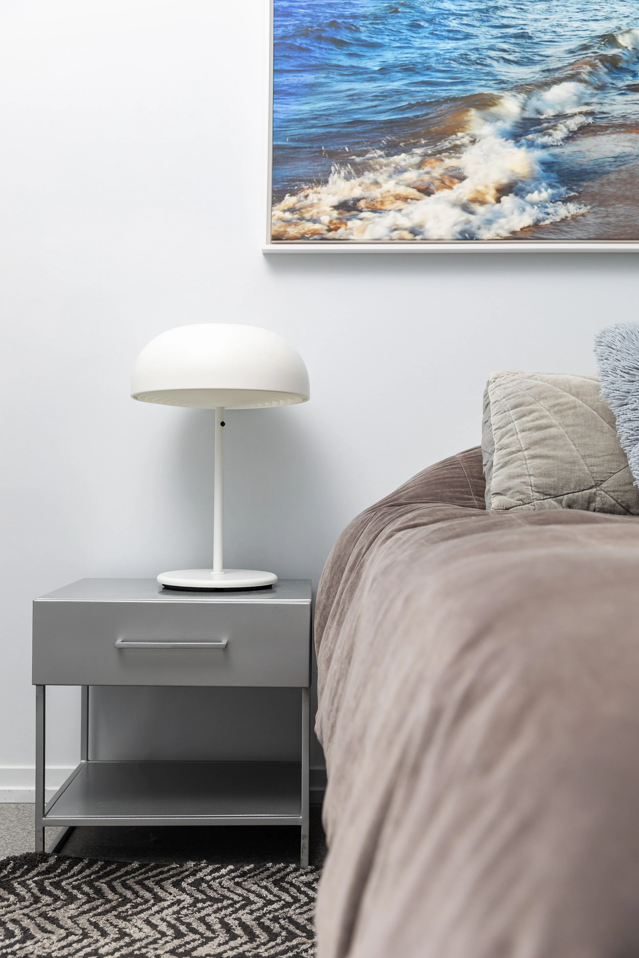Detail of the bedding and nightstand for the second bedroom
