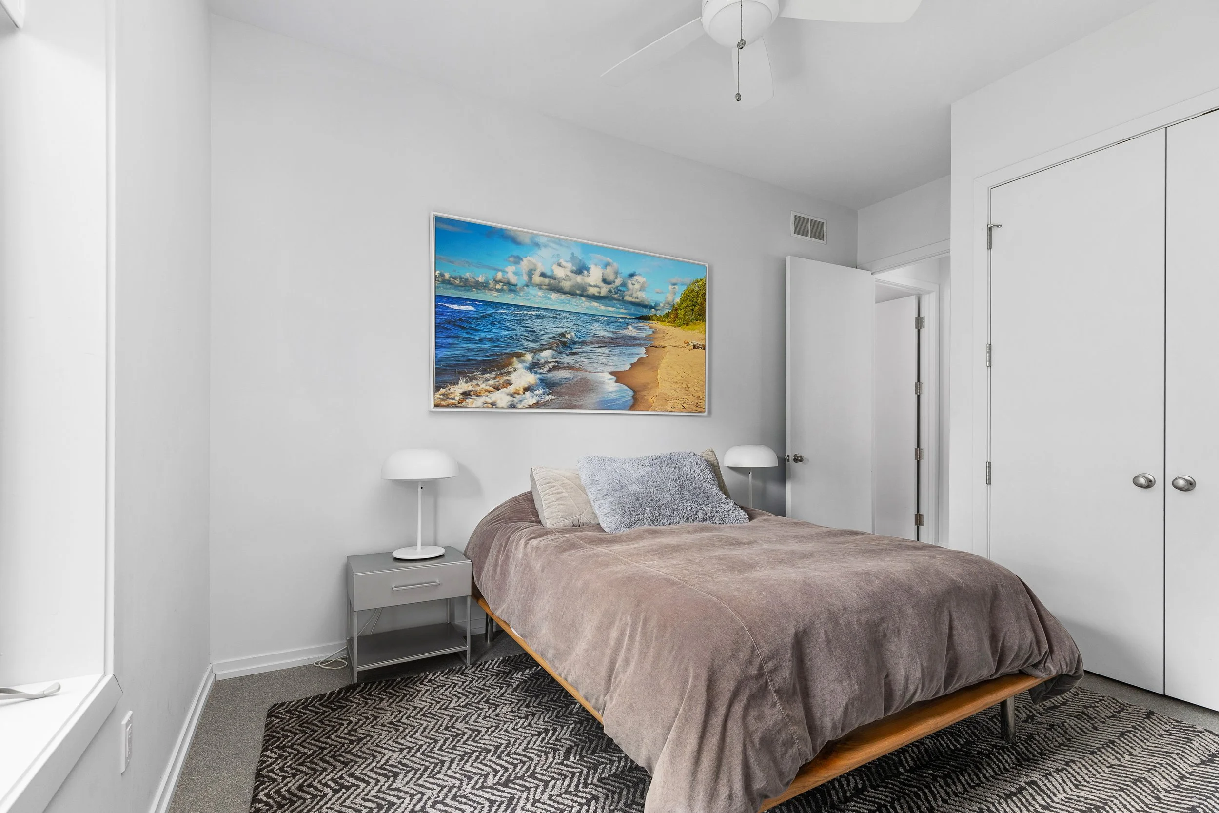 This is the second bedroom on the main level, with a queen bed, and closet.