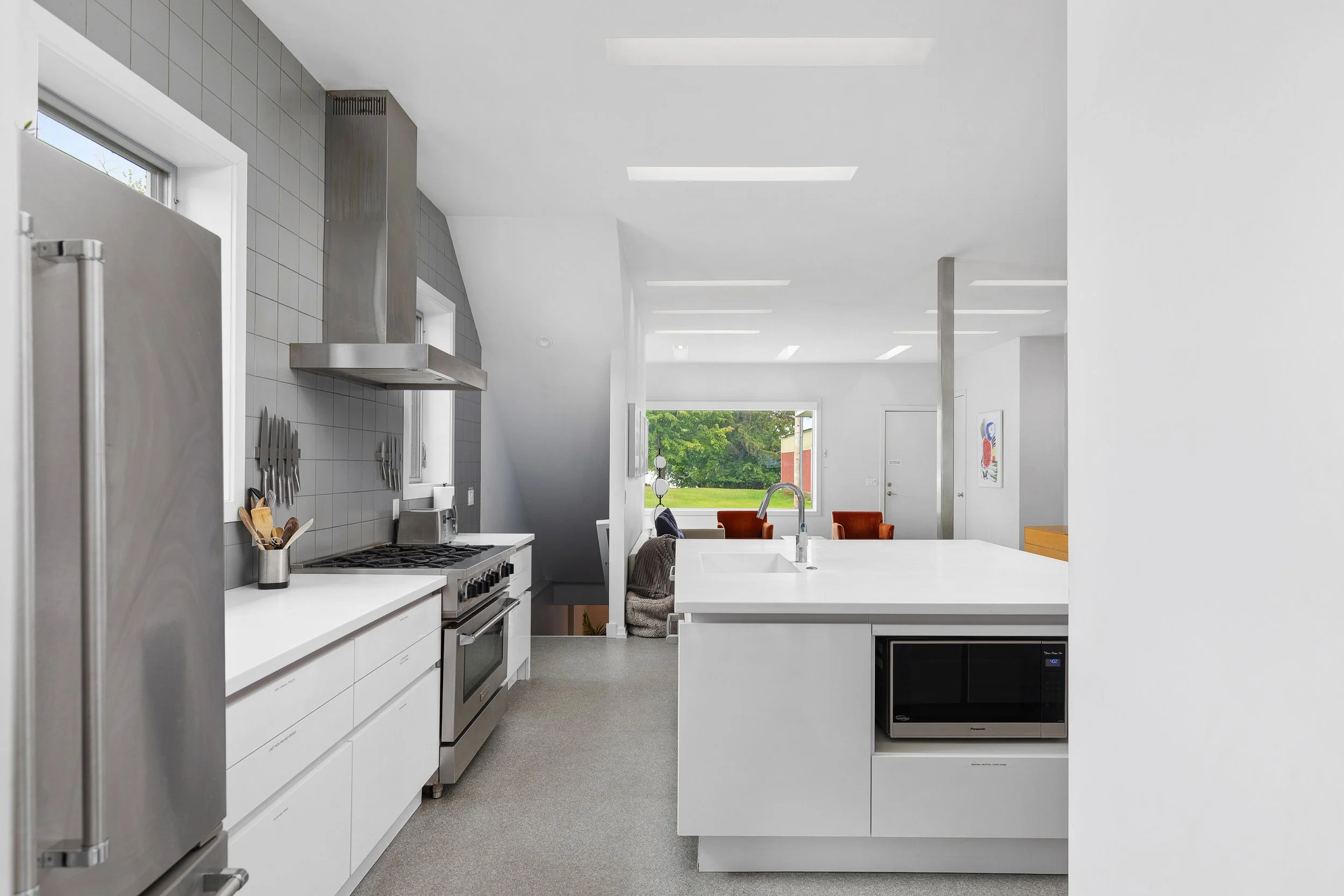 Gourmet kitchen, with a professional range, large fridge, double dishwashers and many small appliances makes cooking truly enjoyable