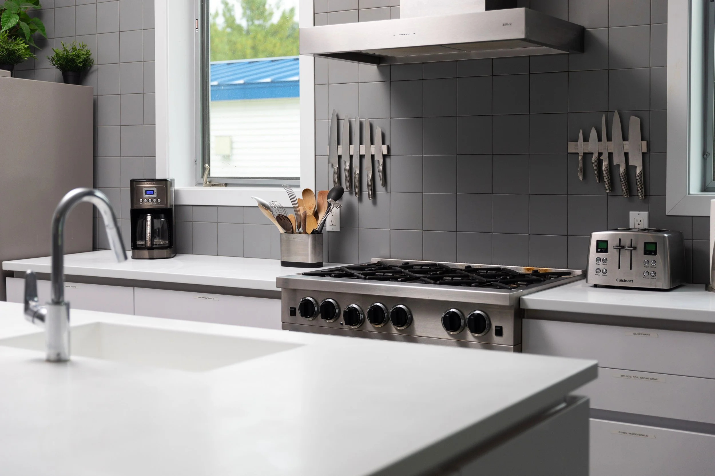 Gourmet kitchen features plenty of counter space and a professional range