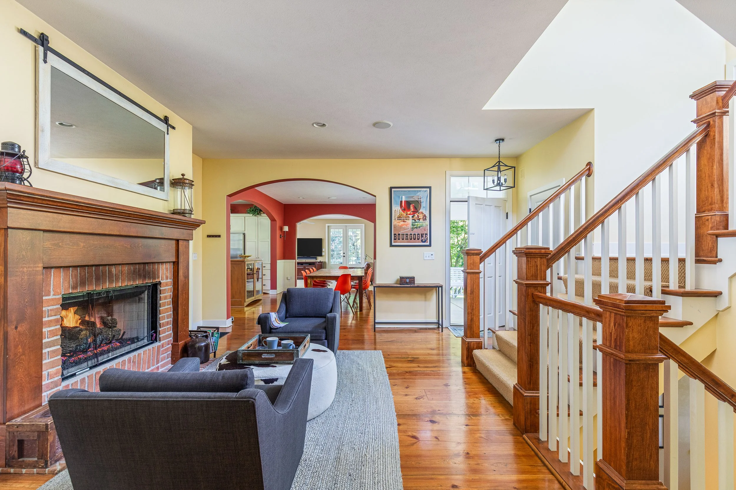 The lounging area is adjacent to the dining room and stairwell