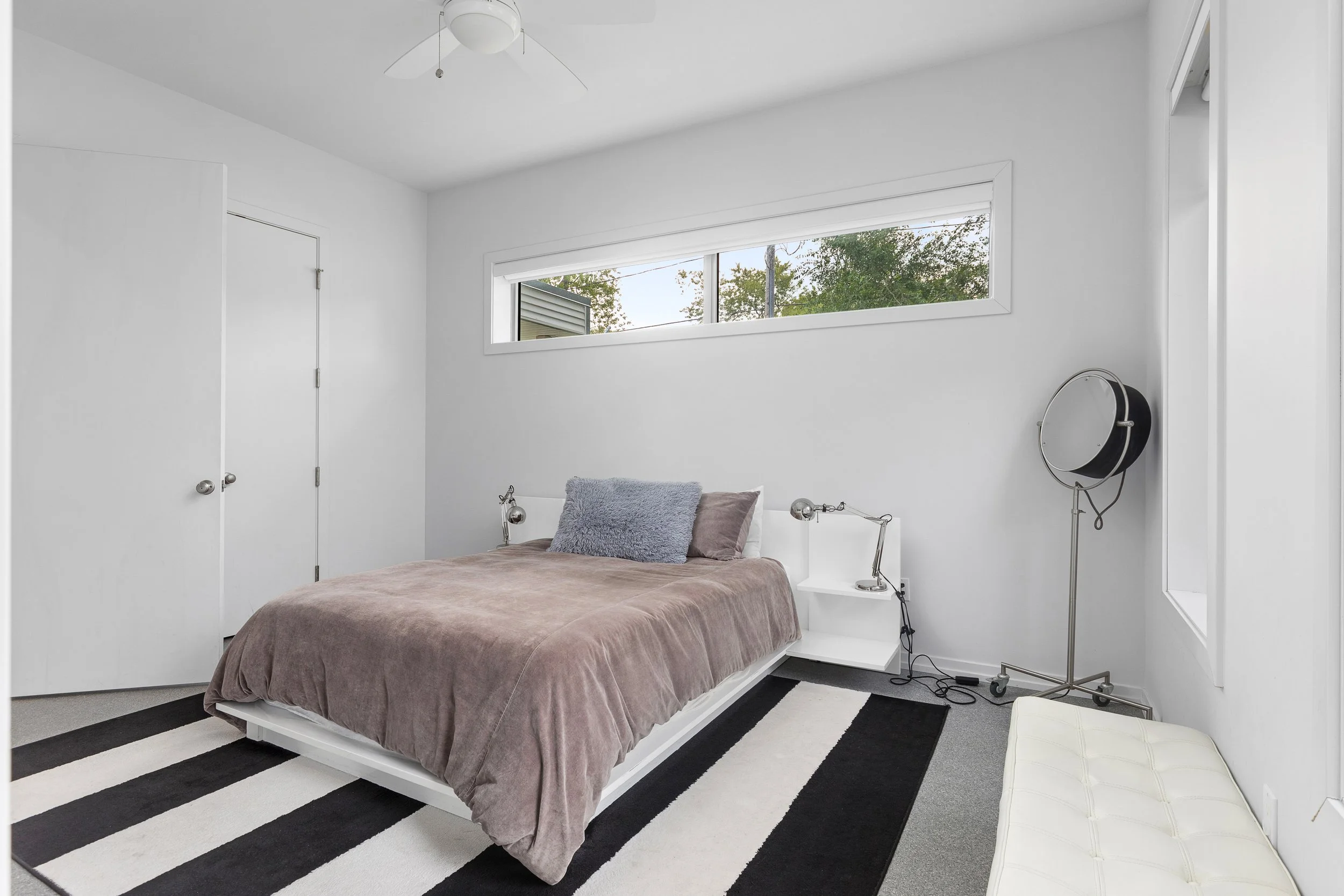 This is the third bedroom on the main level, has a Queen bed, closet, and side bench