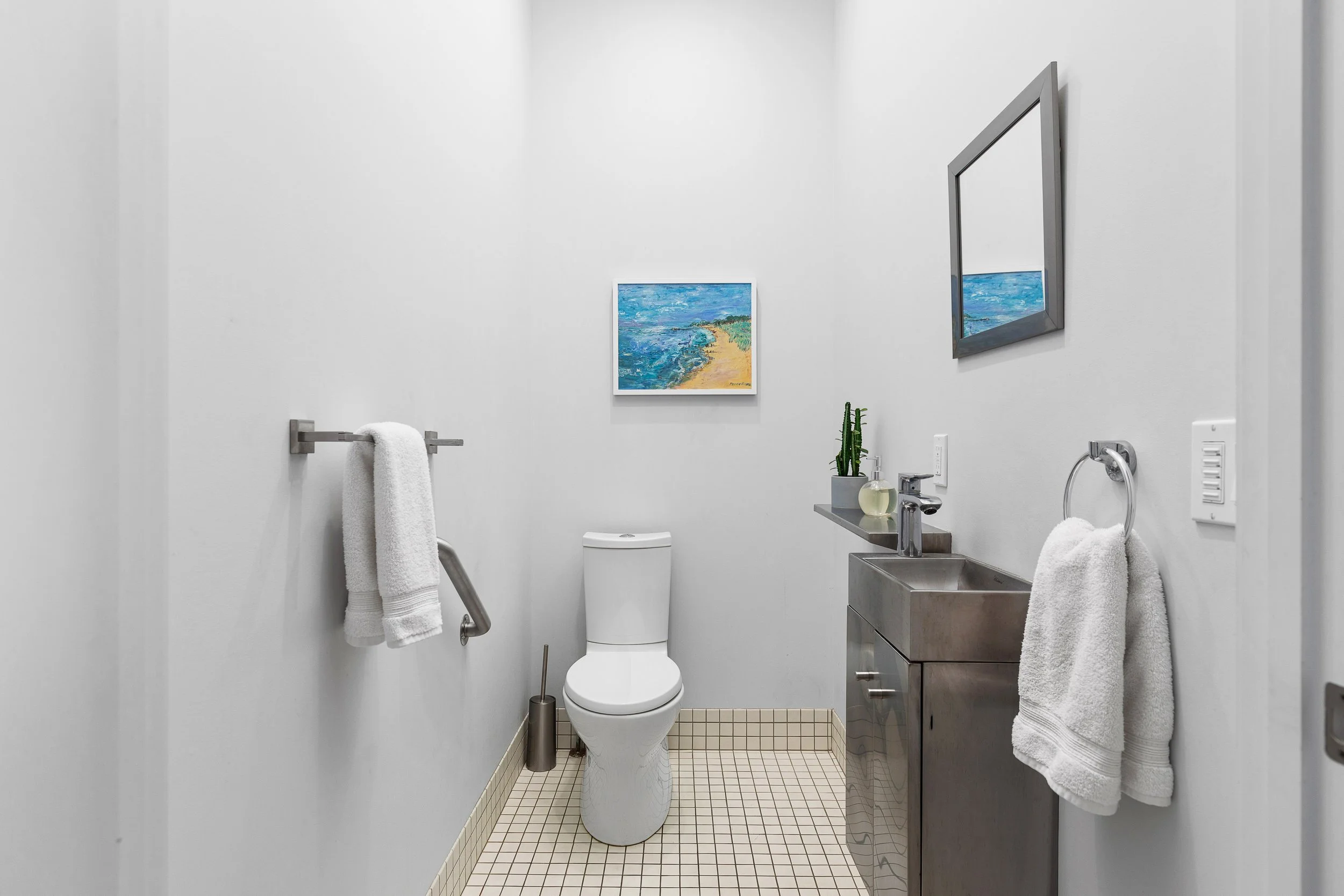 There is a half bath right next to the kitchen