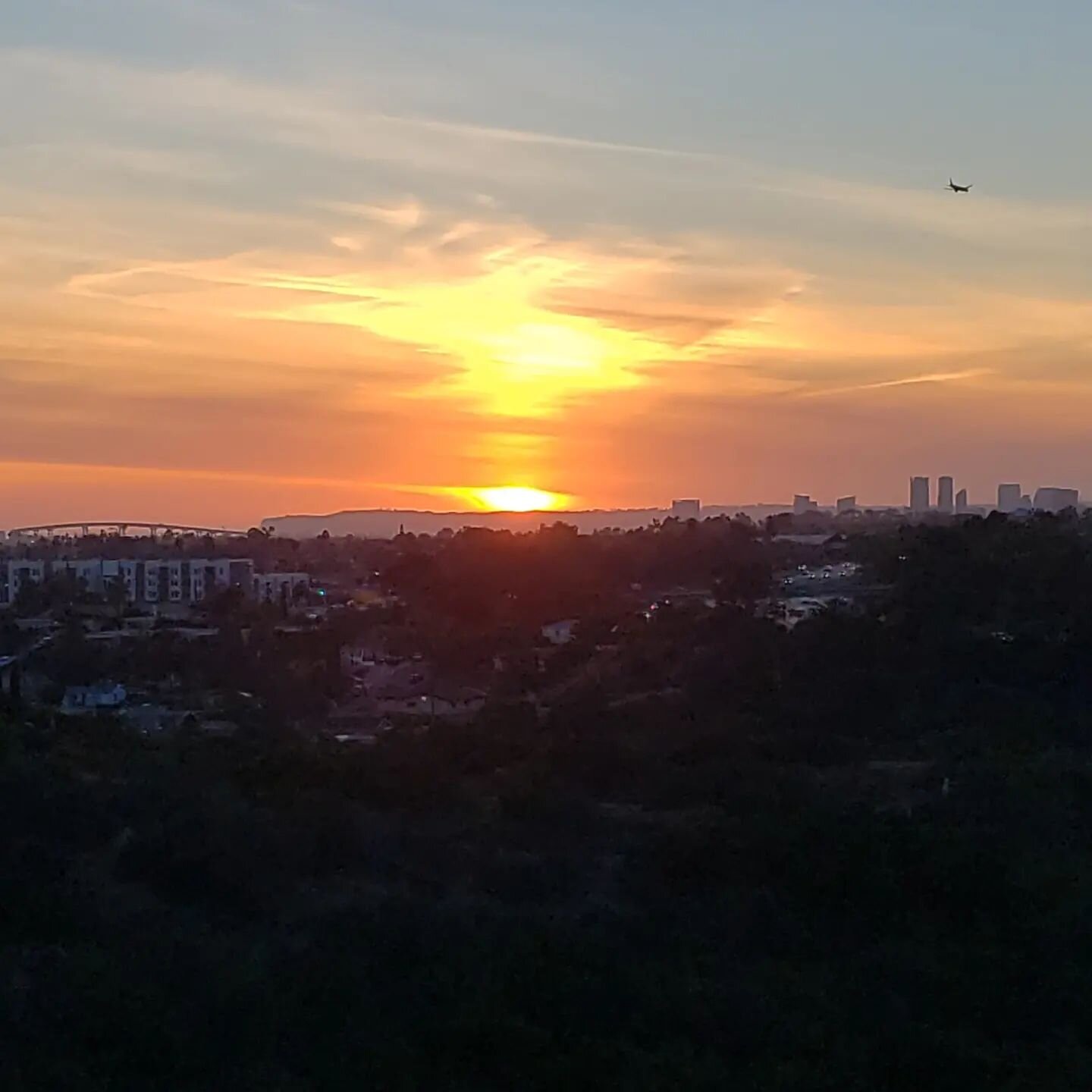 Another beautiful San Diego sunset. The Coronado Bridge to the left and see if you can find the plane. Love this city by the bay. 
.
.
.
.
#livingourjourney365 #nomadicroadtravels #homeonwheels #rvlifestyle #nomads #modernrv #rvtoday #fulltimervlivin