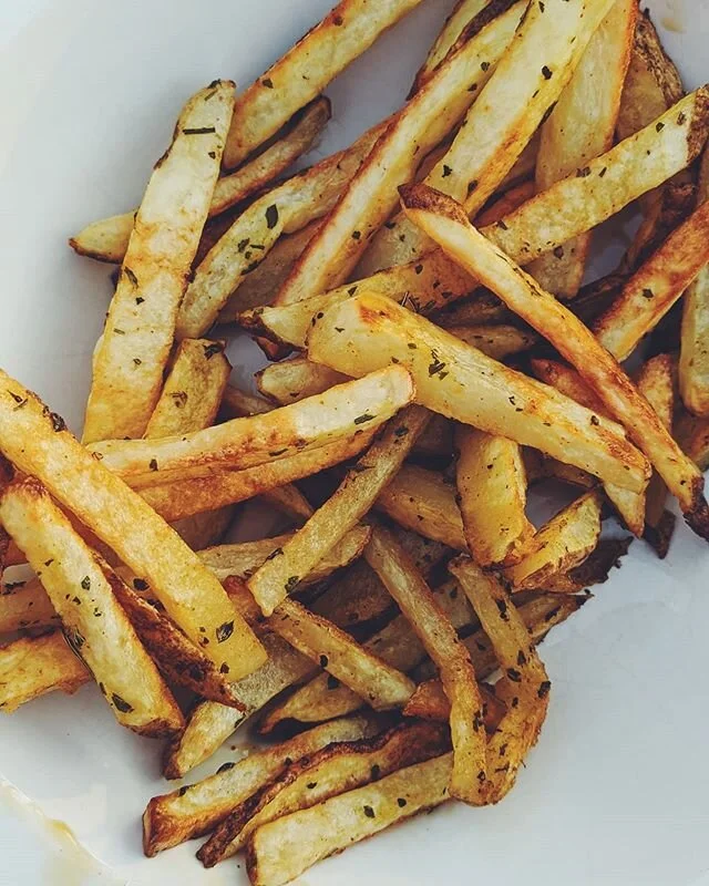Vegan herb fries. Amazingly some french fries aren't vegan but when you make them yourself, you can guarantee it. @pickuplimes taught me to soak them in cold water for 1-24 hours and holy cow does it make a difference. They are so crispy! Then drain,
