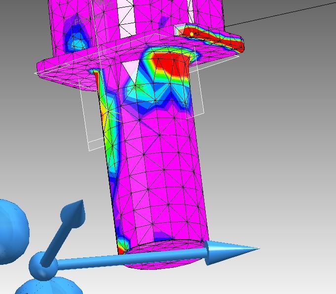 A computer-generated simulation of a mechanical component showing stress distribution, with areas of high stress highlighted in red and lower stress in blue, middle part in green, pink, yellow, and purple.