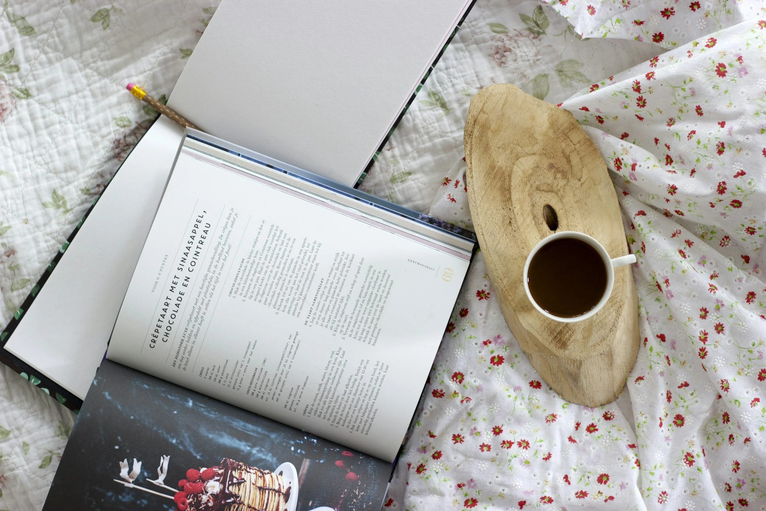 overhead view of cookbook and a cup of coffee