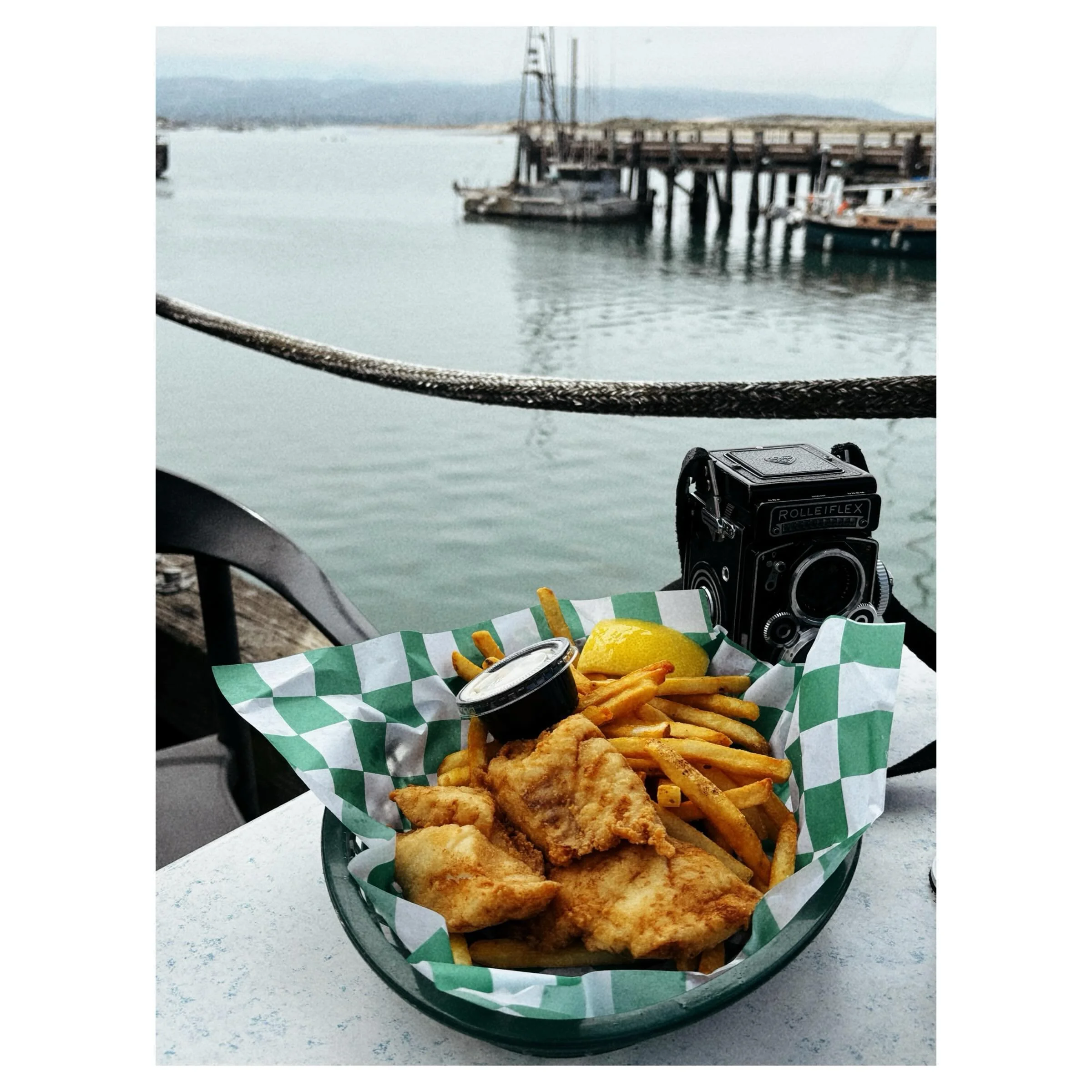 Rockfish chippy and my Rollei (70 years old!) at Tognazzini&rsquo;s in Morro Bay. Easily one of the best fish &amp; chip baskets I&rsquo;ve ever had. So fresh I had to slap it. TMax 100 loaded in the Rollei&hellip; #morrobay #fishandchips🐟 #andymcro