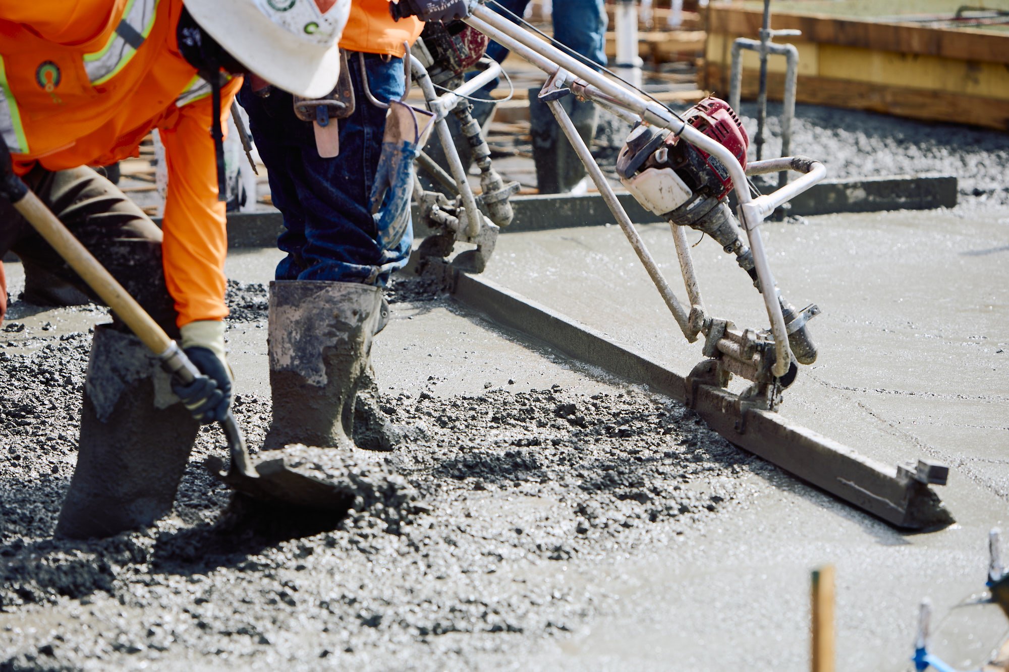Leveling during a concrete pour, San Diego, California construction progress photography 