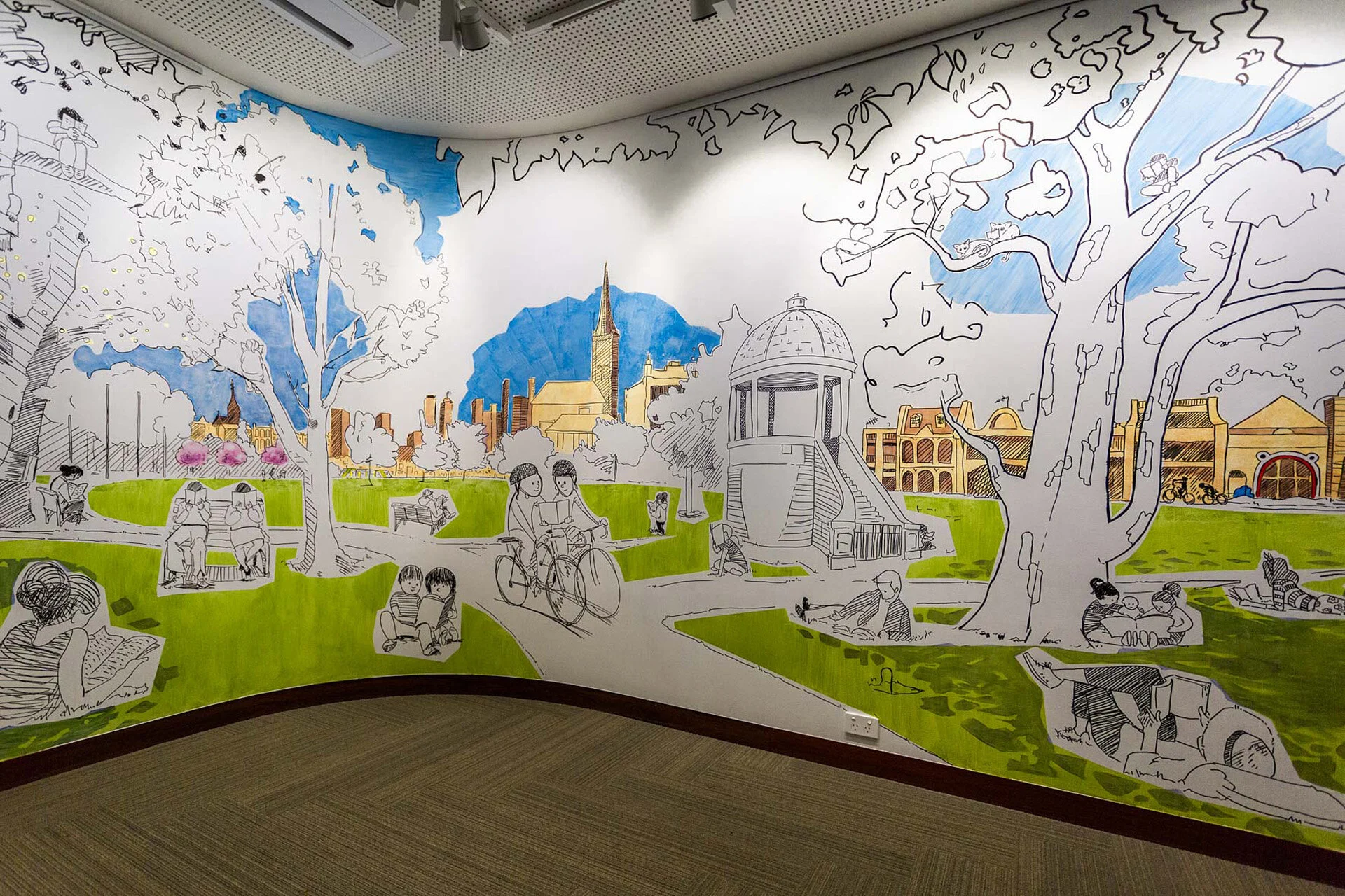 Reading in Edinburgh Gardens, a hand-painted mural in a children's library, by Simon O'Carrigan.