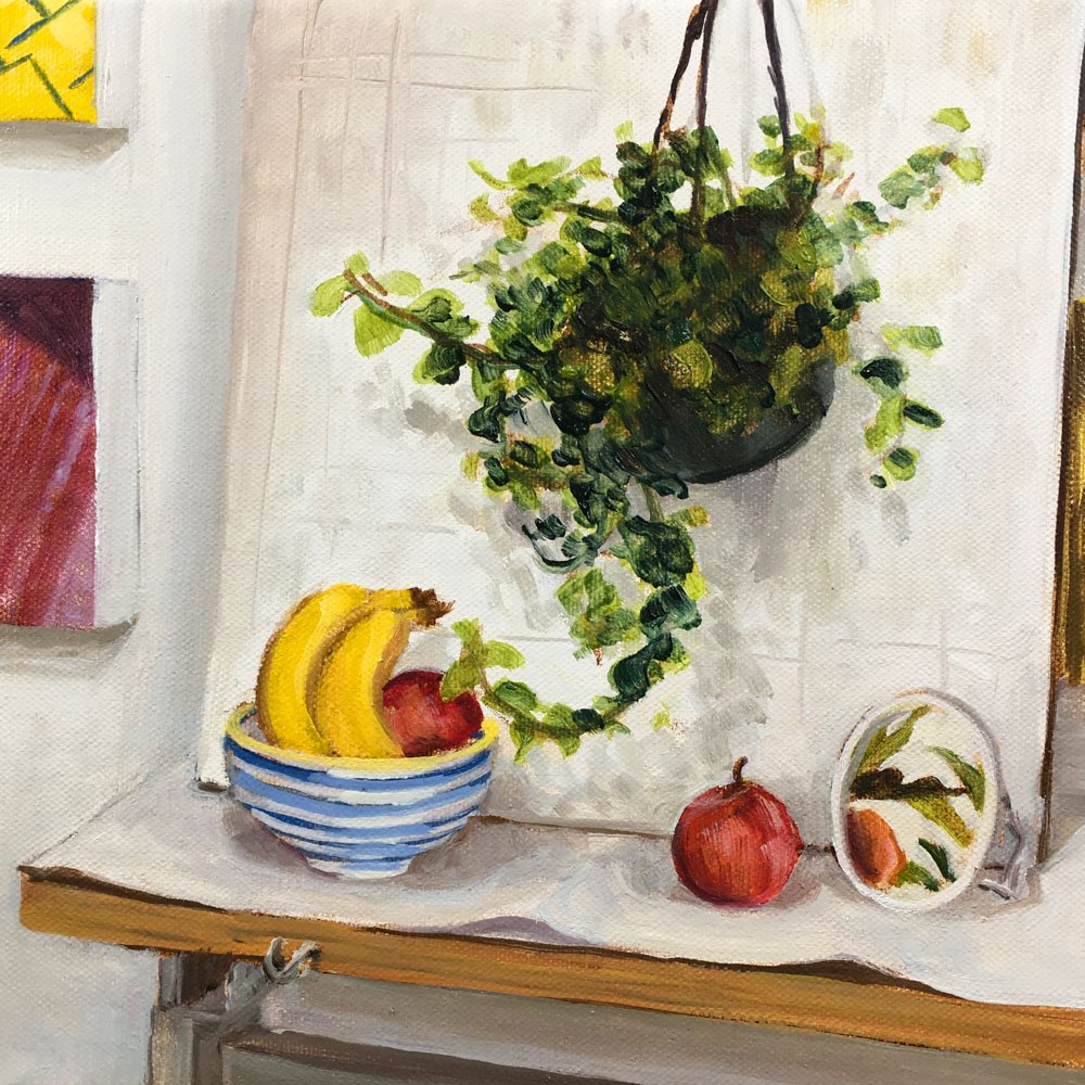 Oil paint study of a still life featuring a hanging plant, fruit bowl, mirror, amid a backdrop of the artist's studio. Artwork © Simon O'Carrigan, 2022.
