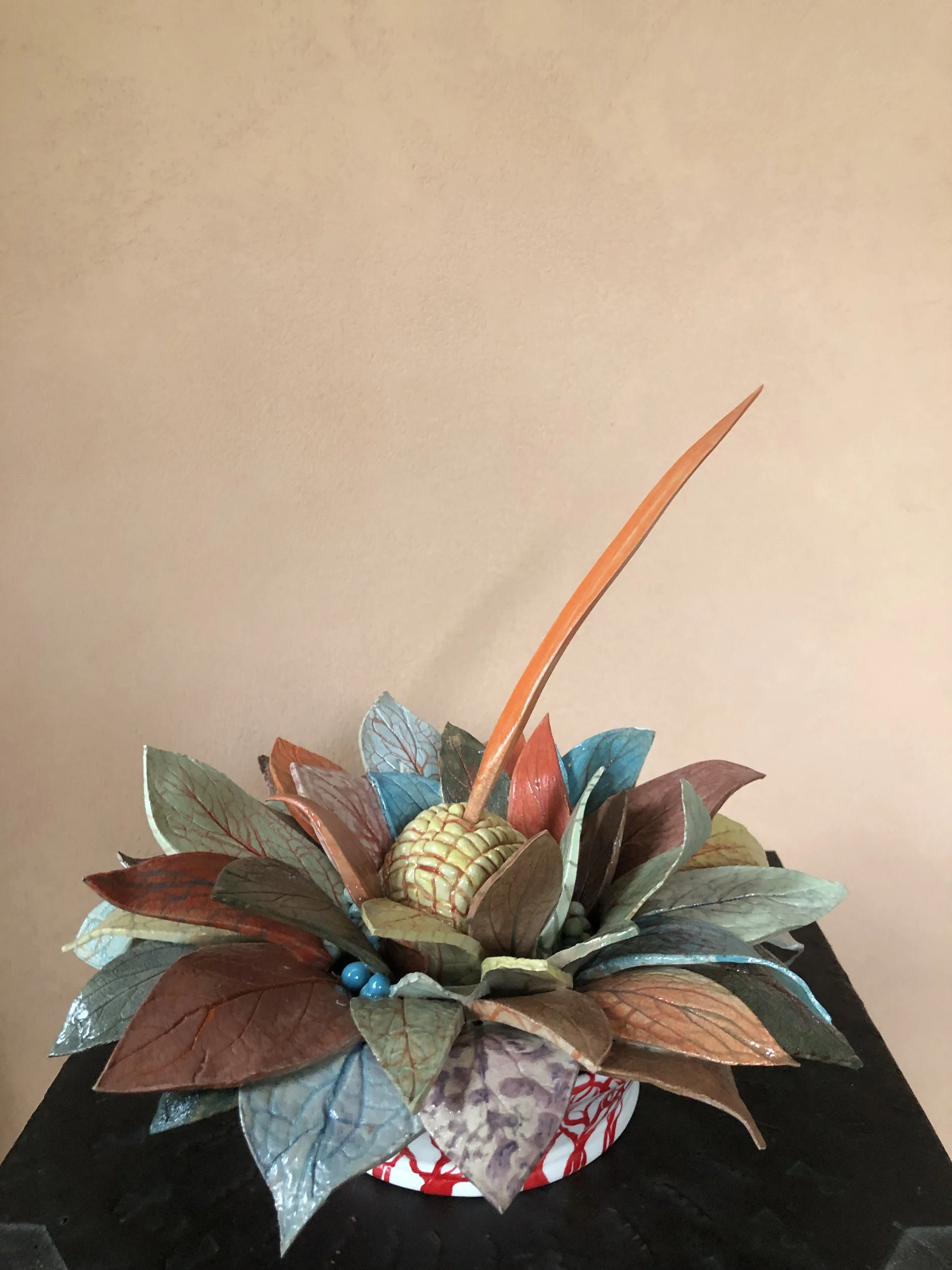 Kate Braine  
Dock Leaves in a pot with orange stem  
Ceramic  
£ 500