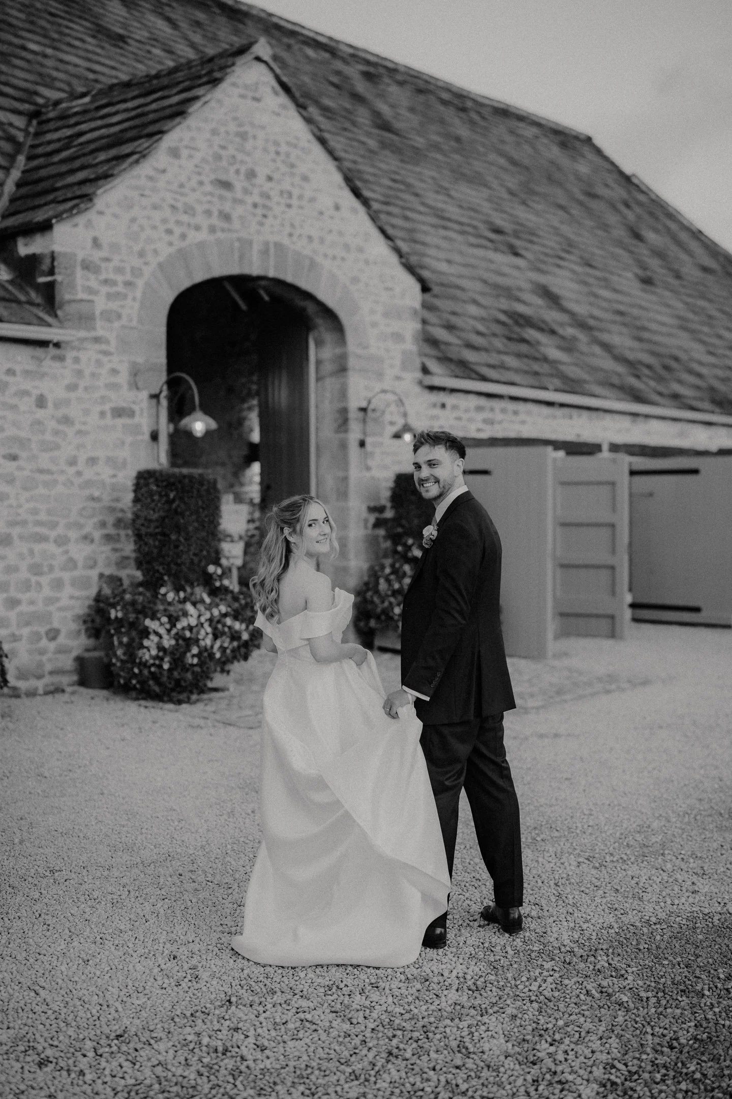 Black and White Bride and Groom shot outside the Tithe Barn at Bolton Abbey, Skipton