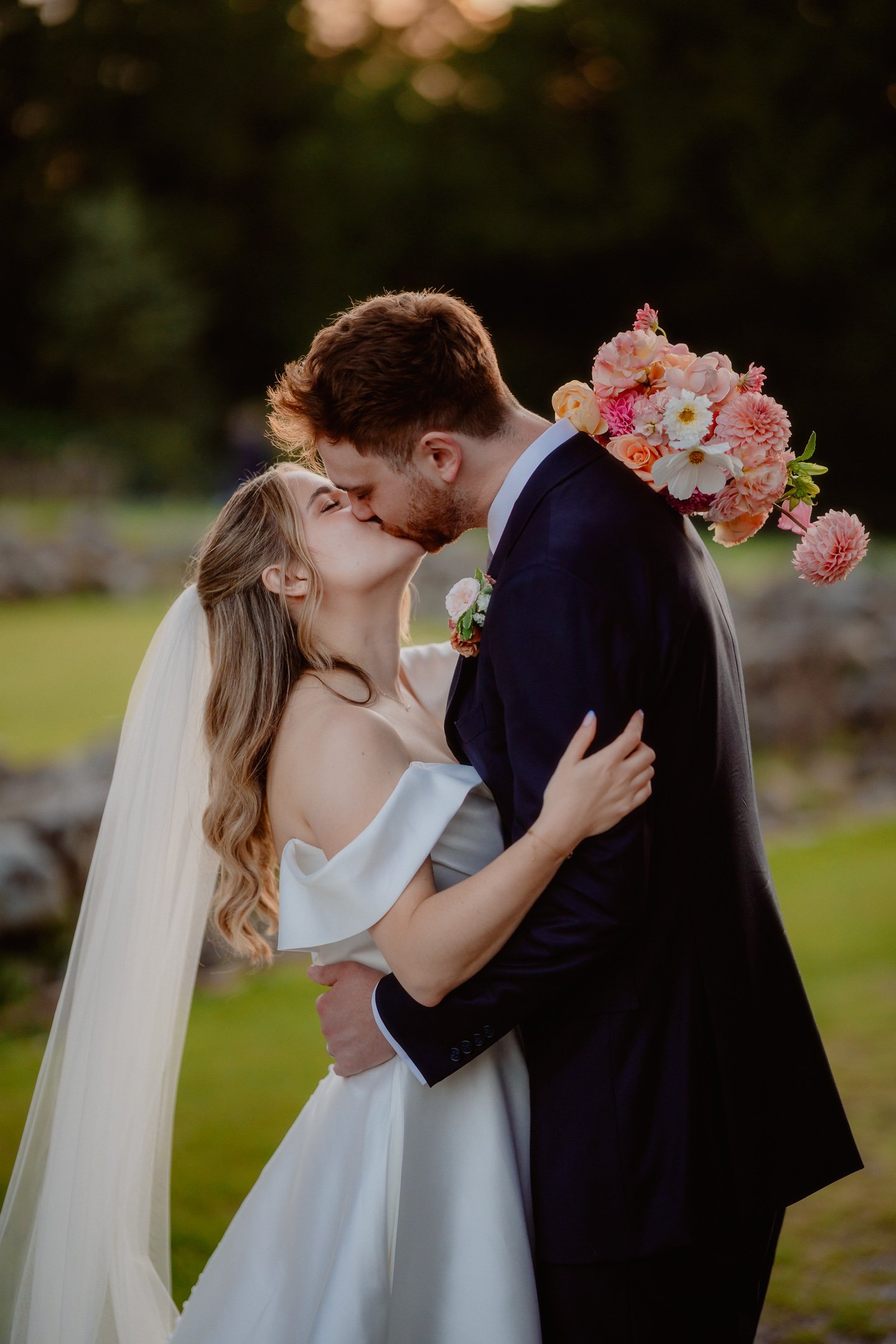 Bride and Groom kiss at the Tithe Barn, by Leeds Wedding photographer photoJMO