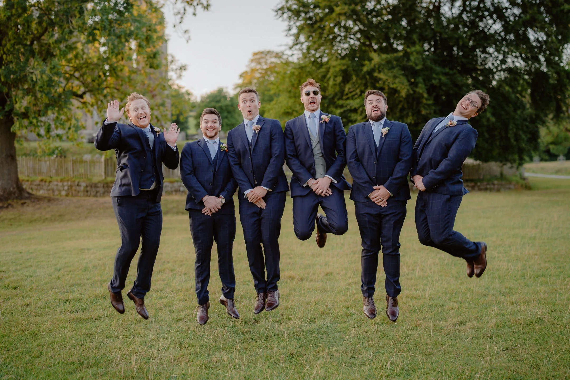 Fun Groomsmen group shots at Bolton Abbey, Tithe Barn - Leeds Wedding Photography