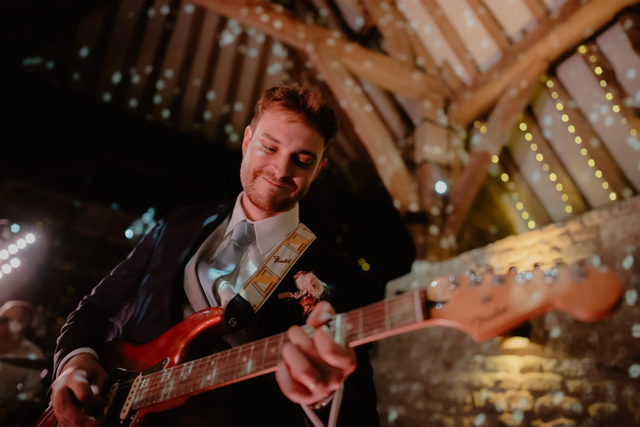 Groom performing on guitar at Wedding - Documentary Wedding Photographer photoJMO