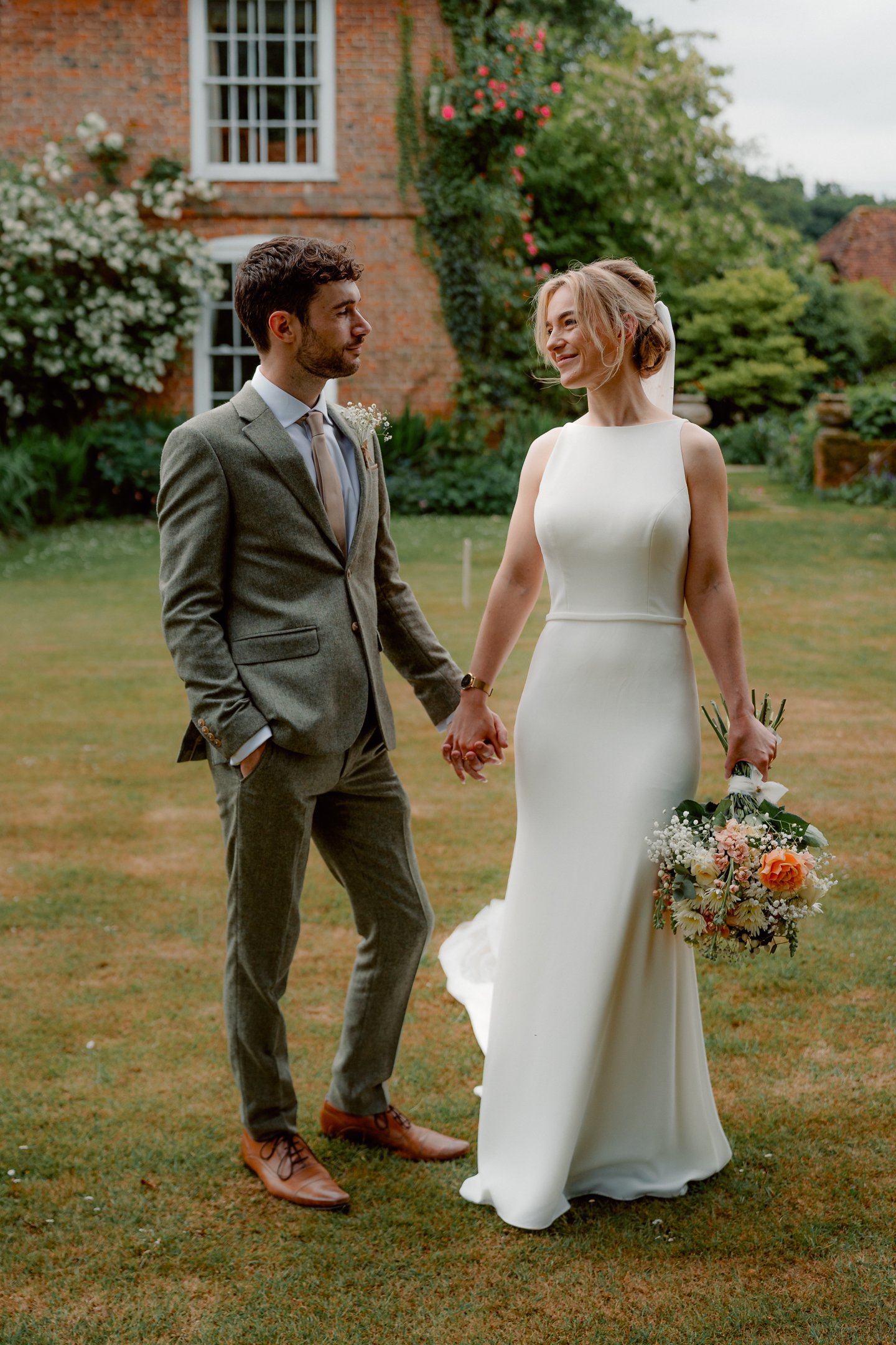 A newly married couple looking lovingly at each other, photographed by London Wedding Photographer photoJMO