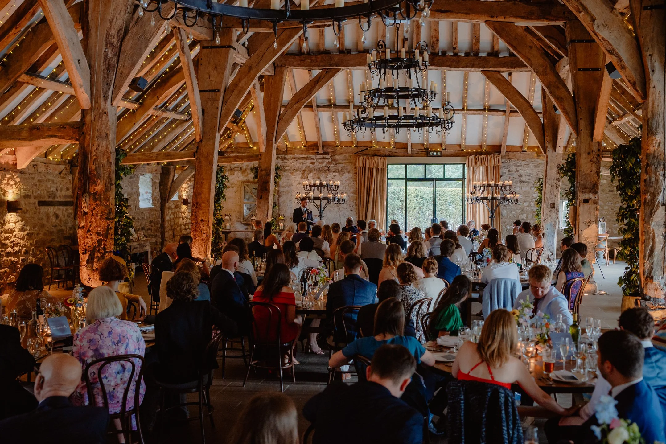 Documentary Wedding Photography - Wide shot of the Tithe Barn during the groom's speech