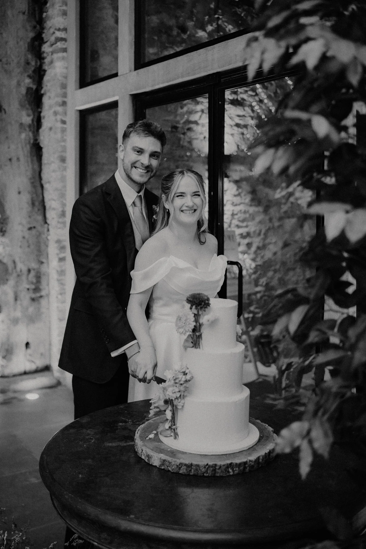 Bride and Groom cake cutting at The Tithe Barn, Bolton Abbey